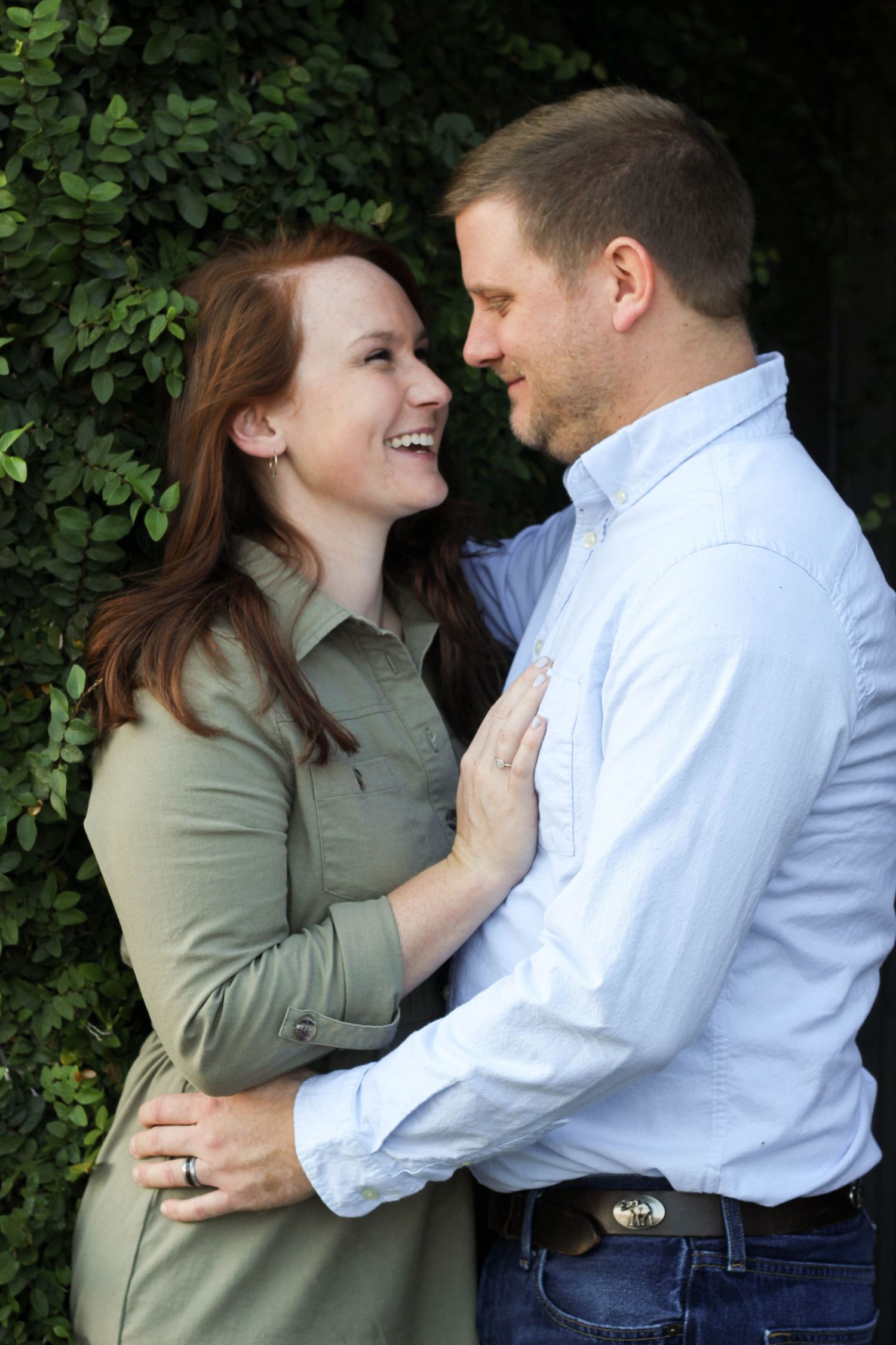 A couple shares an intimate moment outdoors against green foliage in a romantic photo sequence.