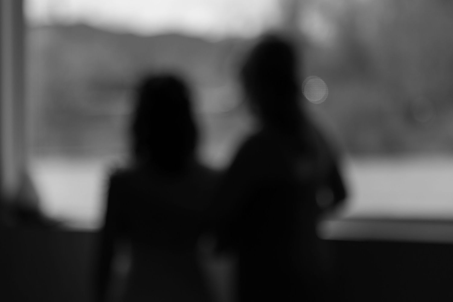 Seven black and white silhouettes of people shown in a filmstrip-style sequence against a light background.