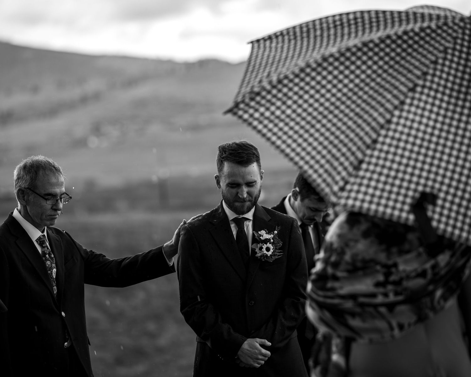 A series of black and white photos showing people walking with umbrellas in rainy weather.