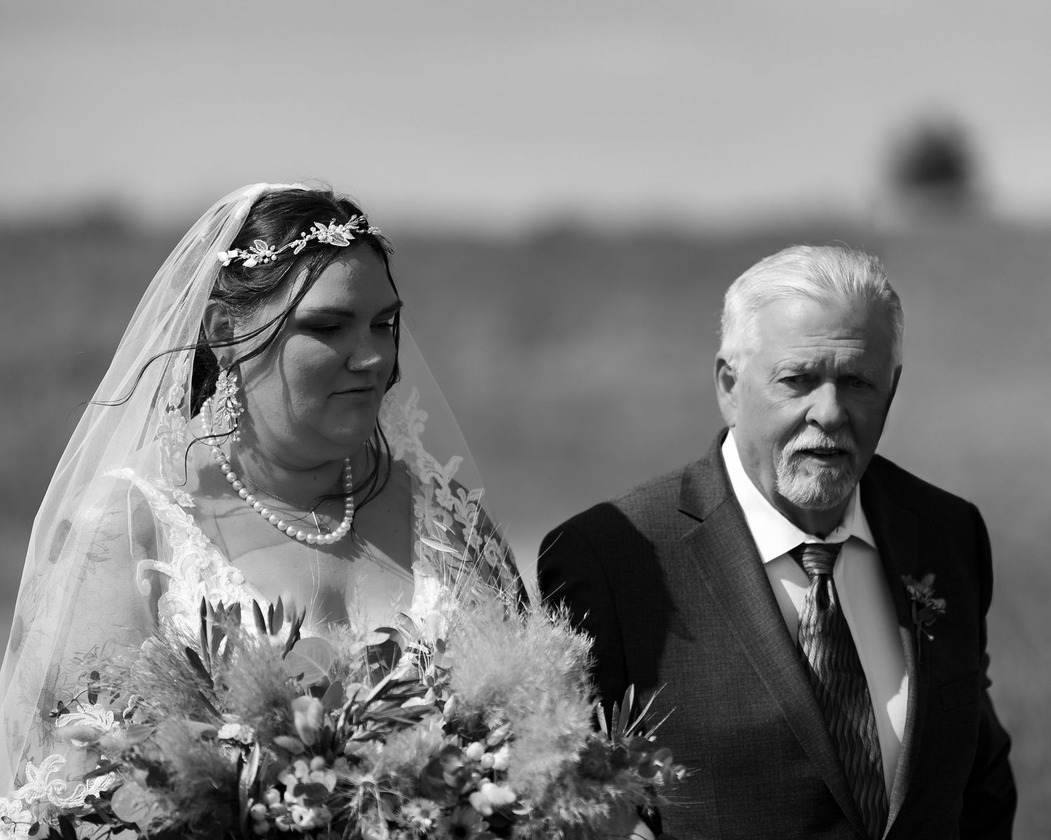 A black and white photo showing a series of emotional moments at a wedding celebration.