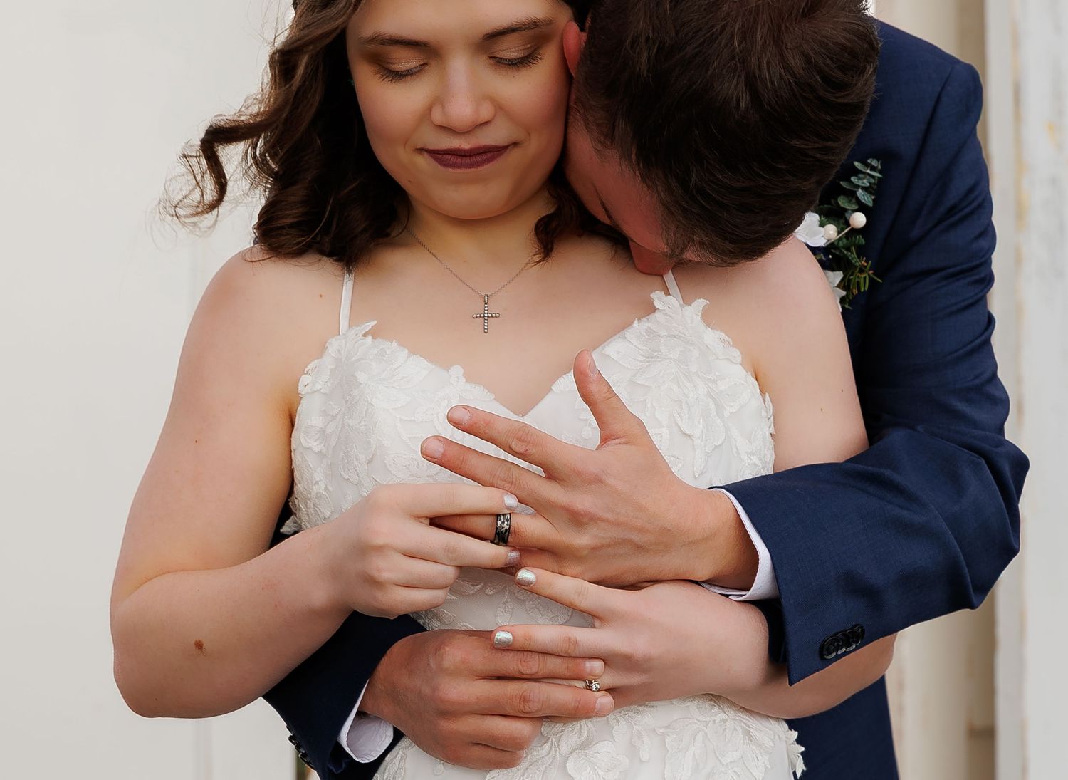Close-up sequence showing hands exchanging wedding rings during an intimate ceremony.