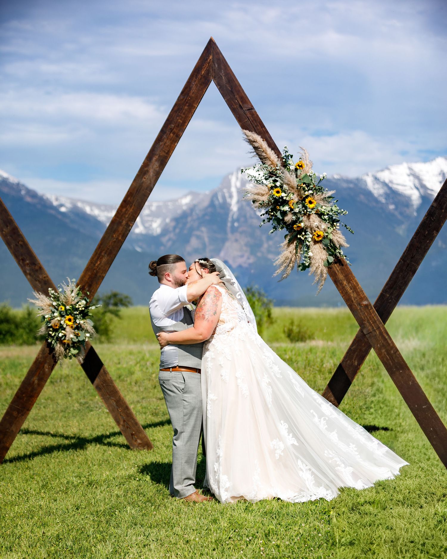 Romantic Montana Wedding photography with bride and groom against a backdrop of snow-capped mountains in St. Ignatius