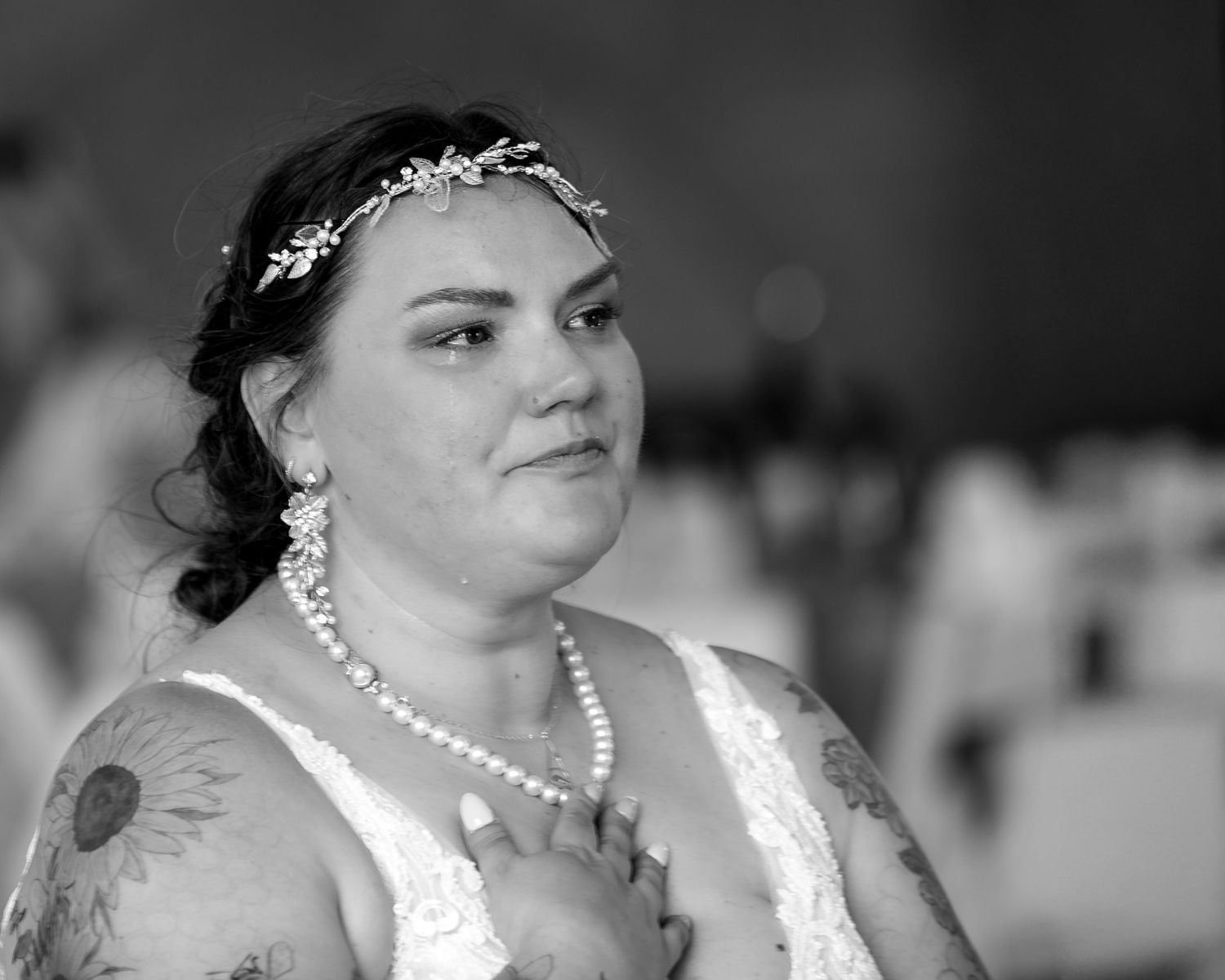 Black and white wedding photo collage showing candid moments and expressions in a romantic setting.