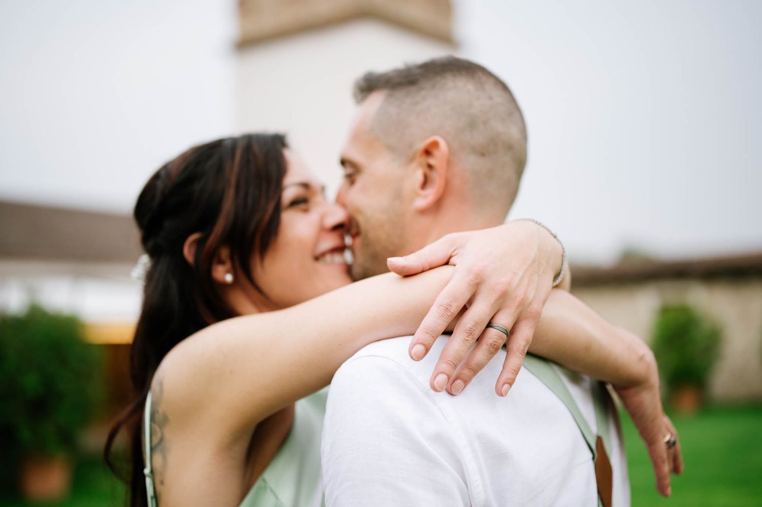 Happy couple embracing and smiling at each other outdoors, destination wedding in Verona, Italy