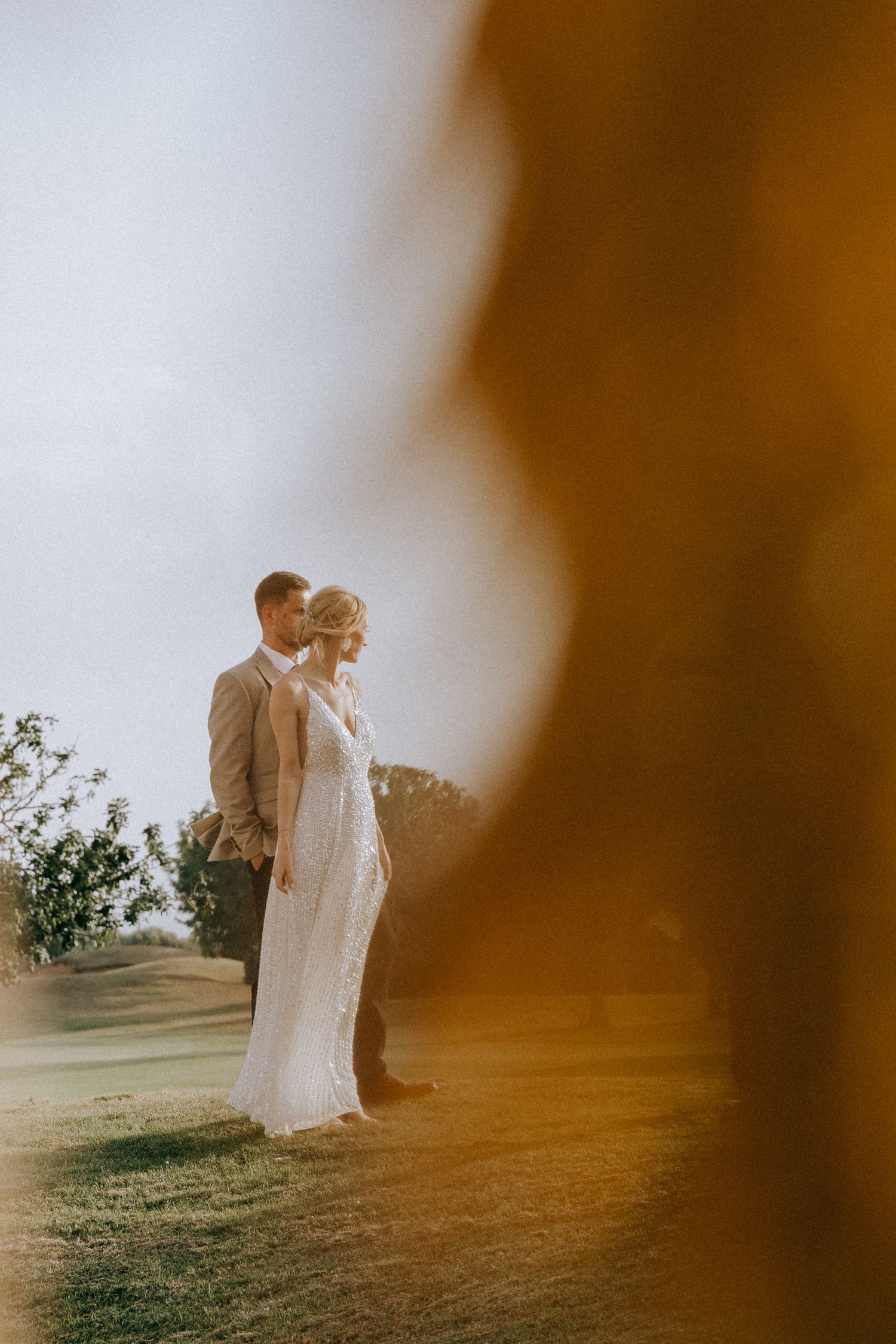 Wedding couple posing for photos during a photoshoot.