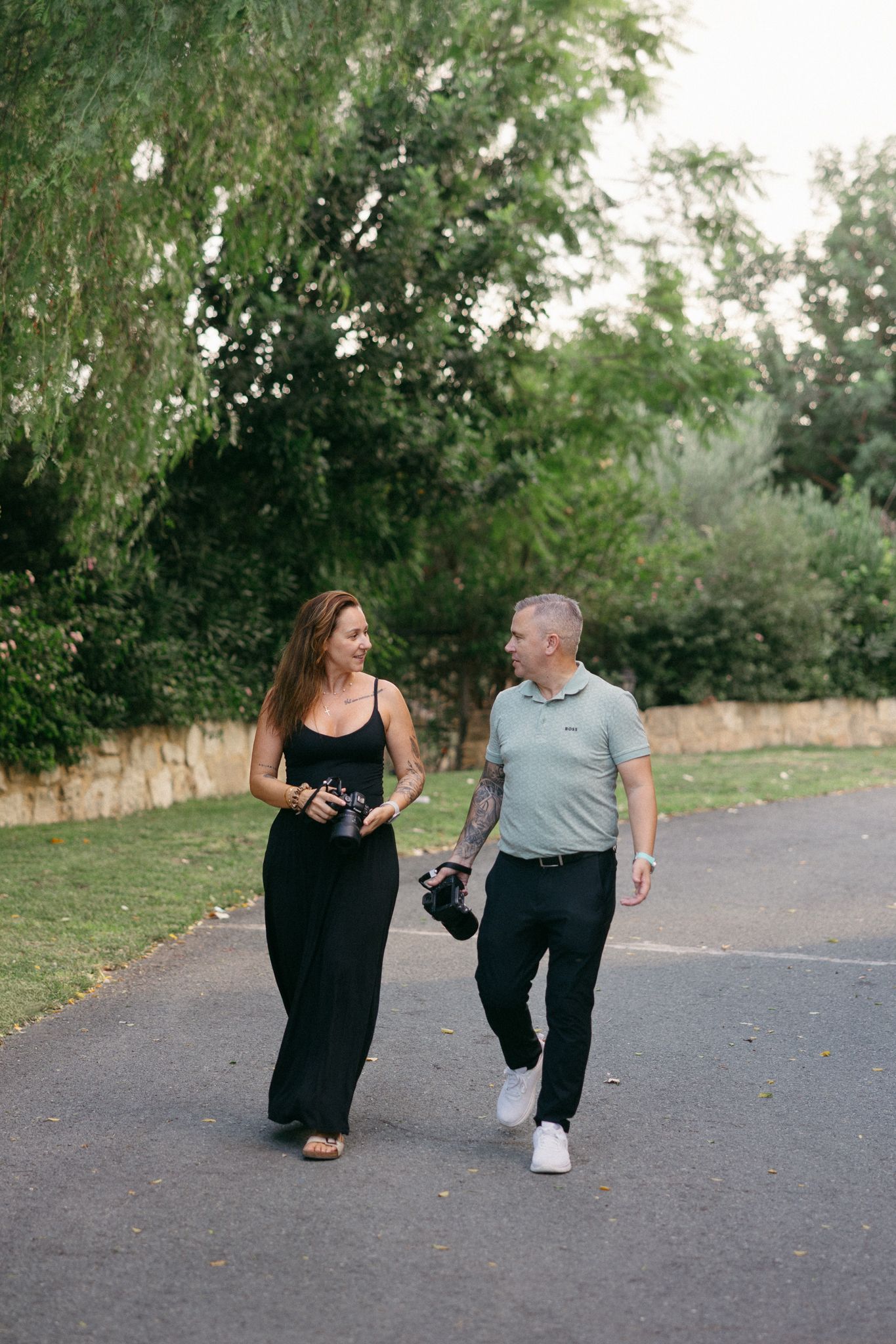 Professional photographers talking and walking during a photoshoot in Cyprus.