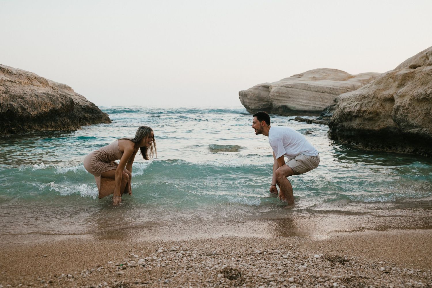 A romantic seaside photo session showing couple interacting on a beautiful Mediterranean beach. Family photographer based in Paphos