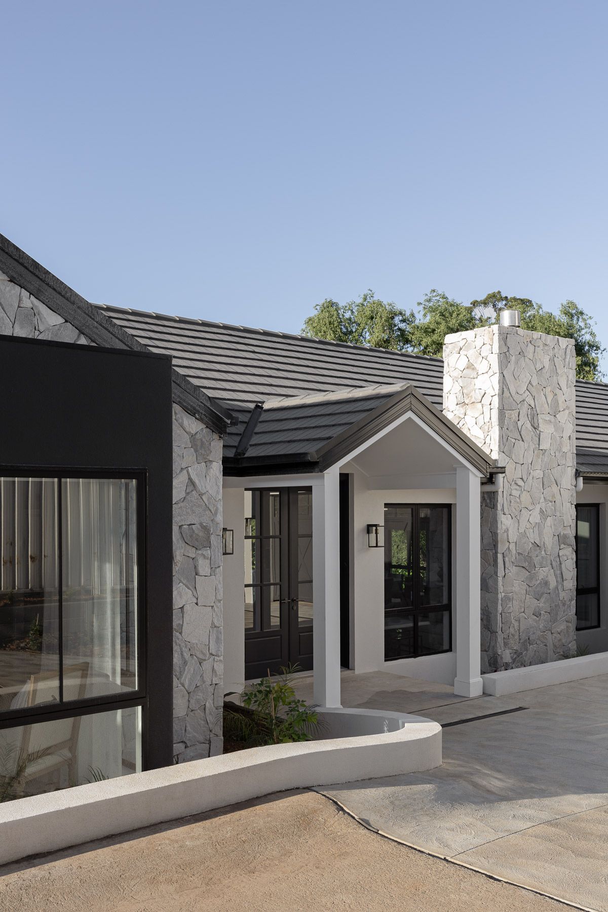 Modern farmhouse with stone details in Jamberoo, NSW.