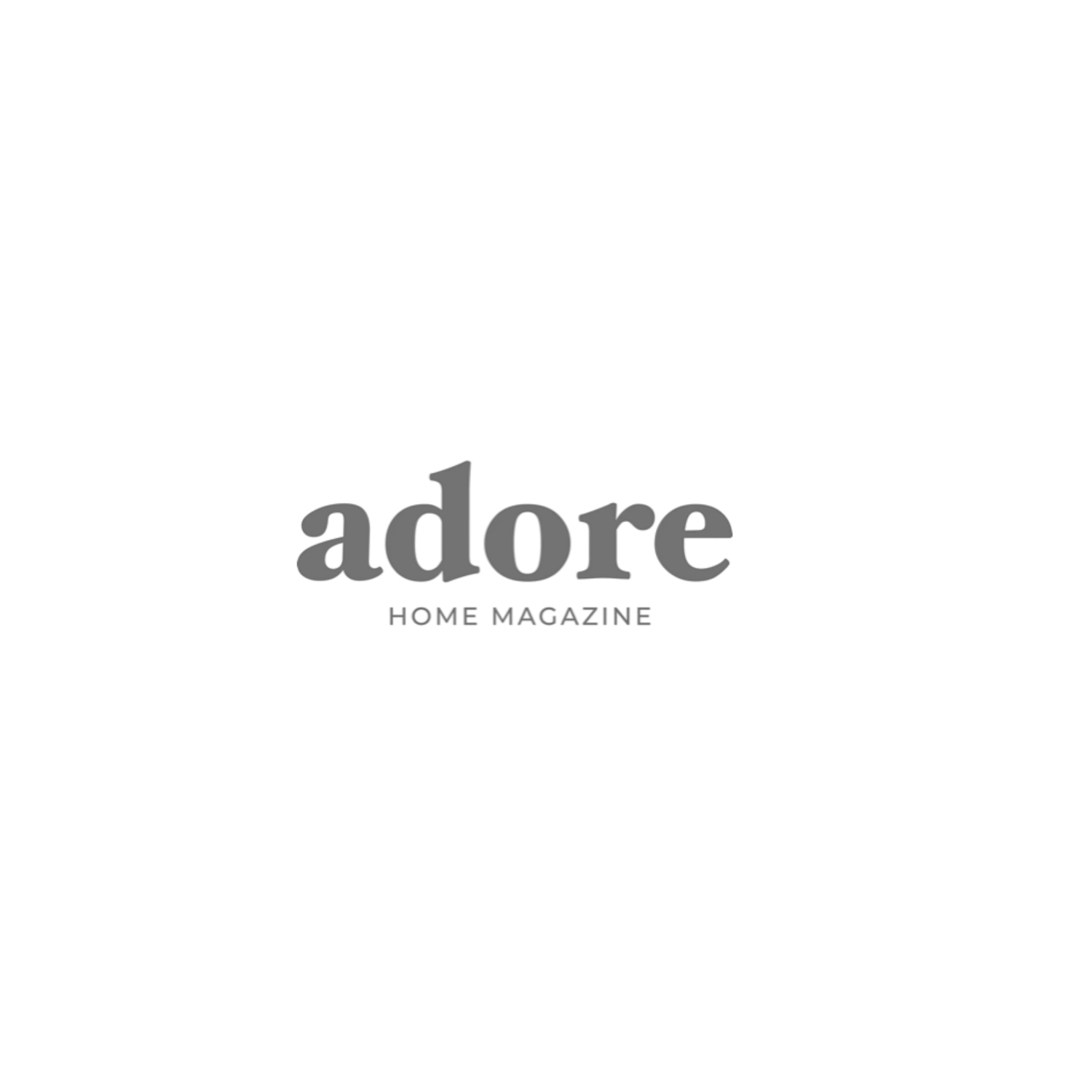 Gray logo of Adore Home Magazine displayed on a clean white background.