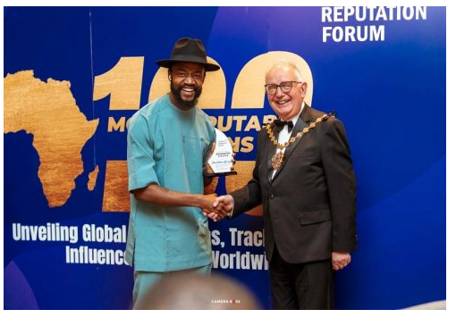 Two men shaking hands at the 100 Most Reputable Africans award ceremony at the Reputation Forum event.