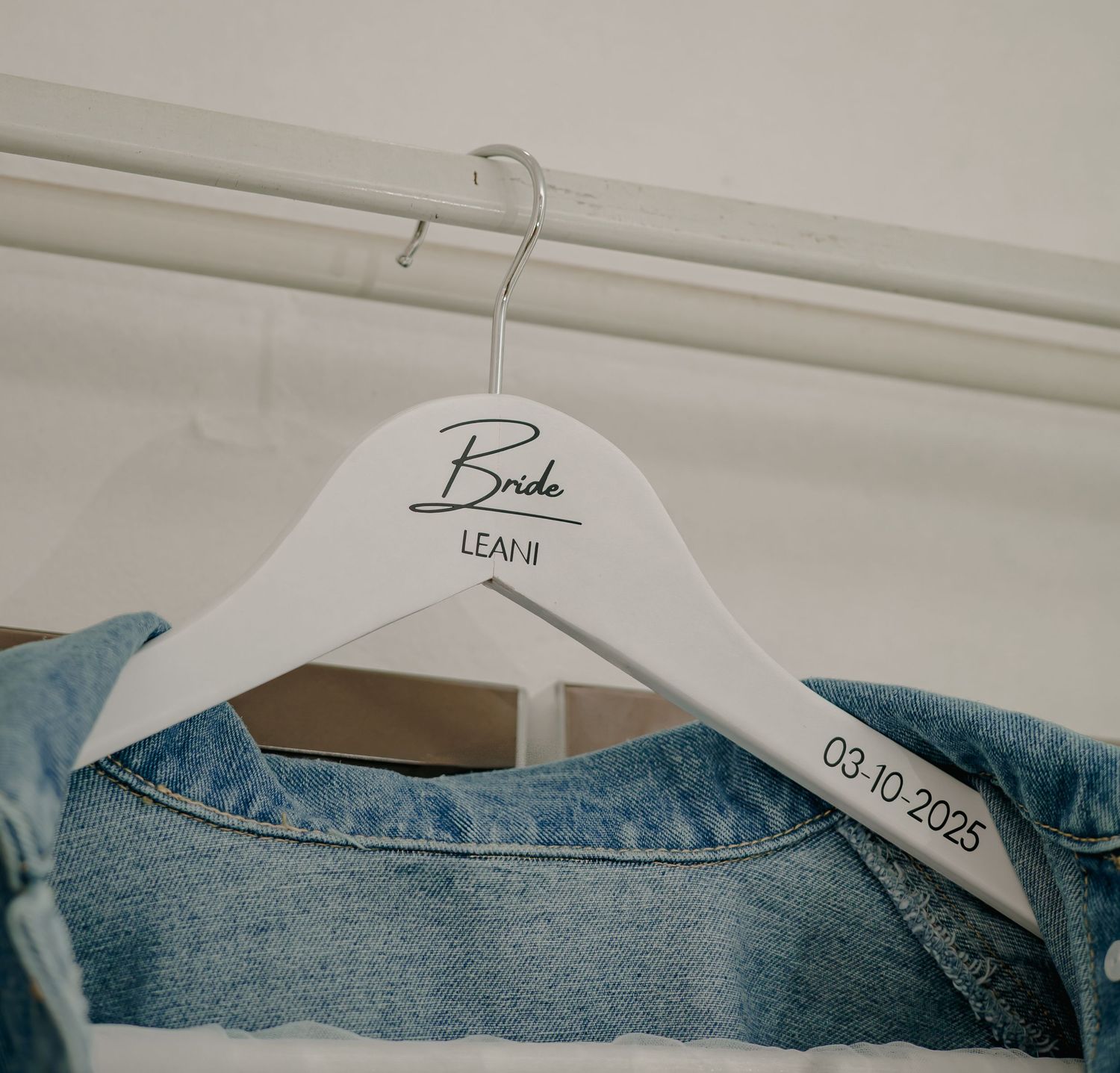 Personalized white bridal hanger for Leani with denim jacket dated 03-10-2025.