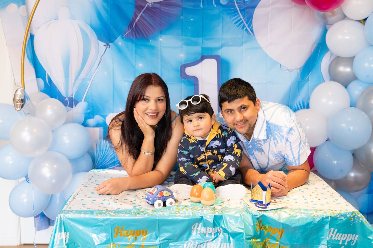 Birthday celebration setup with blue and white balloons creating a festive atmosphere.