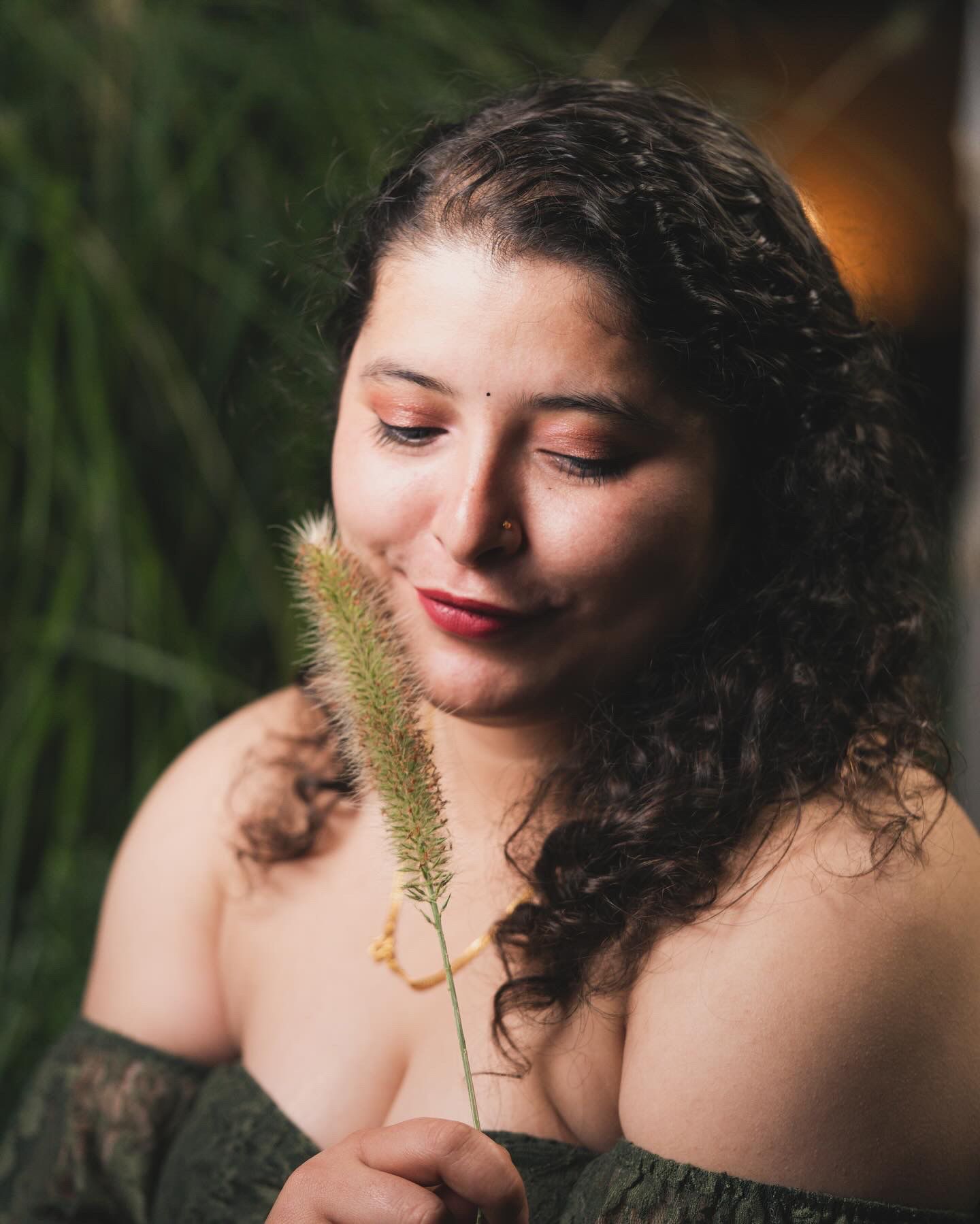 Artistic nature portrait with soft lighting and delicate foliage elements.