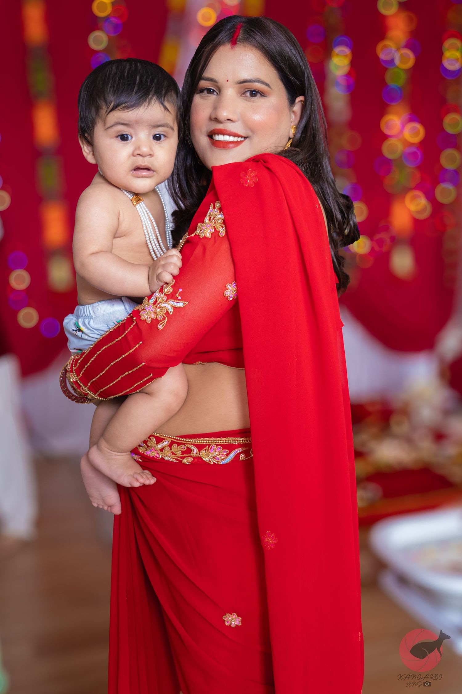 Cultural celebration with vibrant red decorations and traditional attire.
