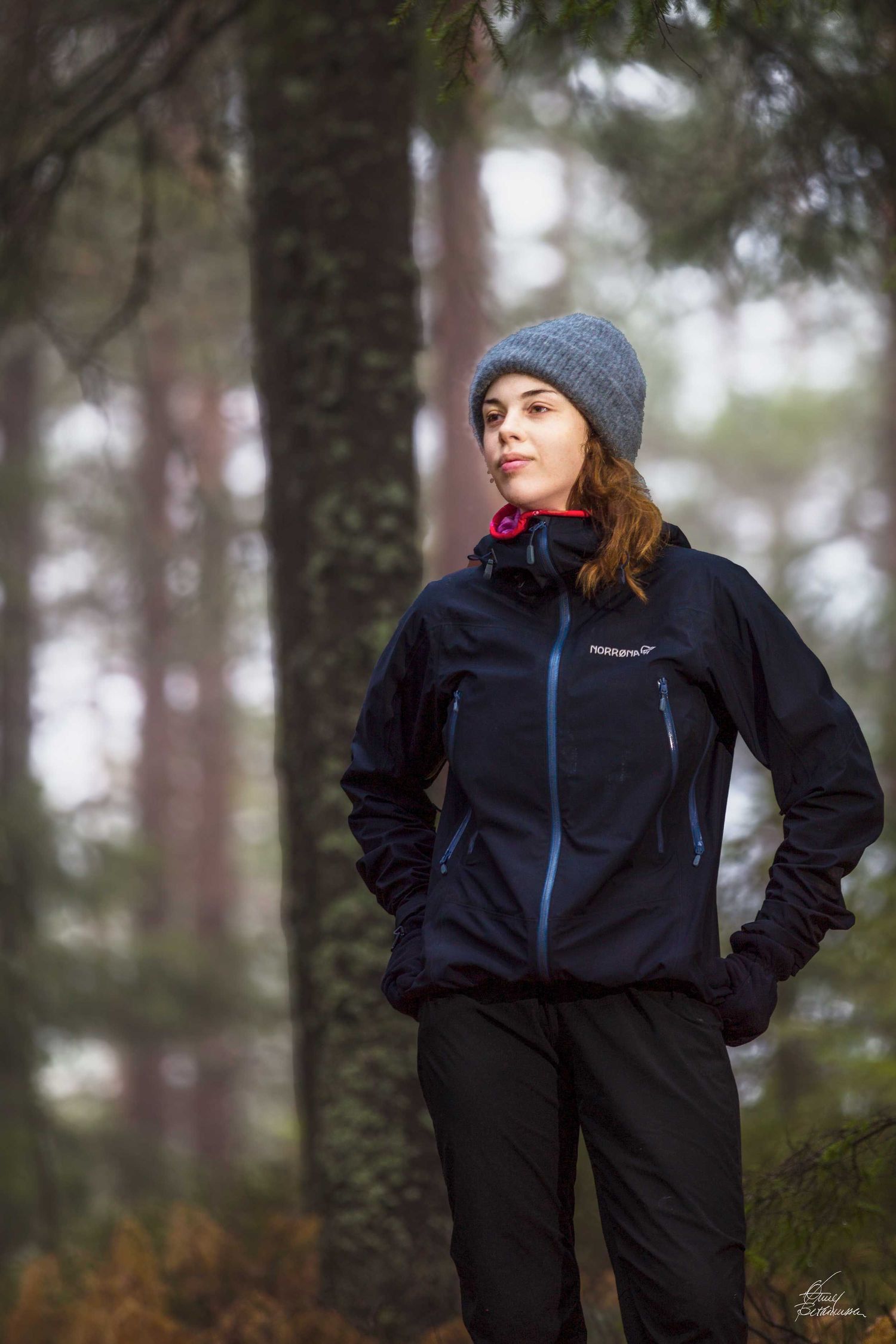Outdoor fashion photography series featuring person in black athletic wear and beanie in forest setting.