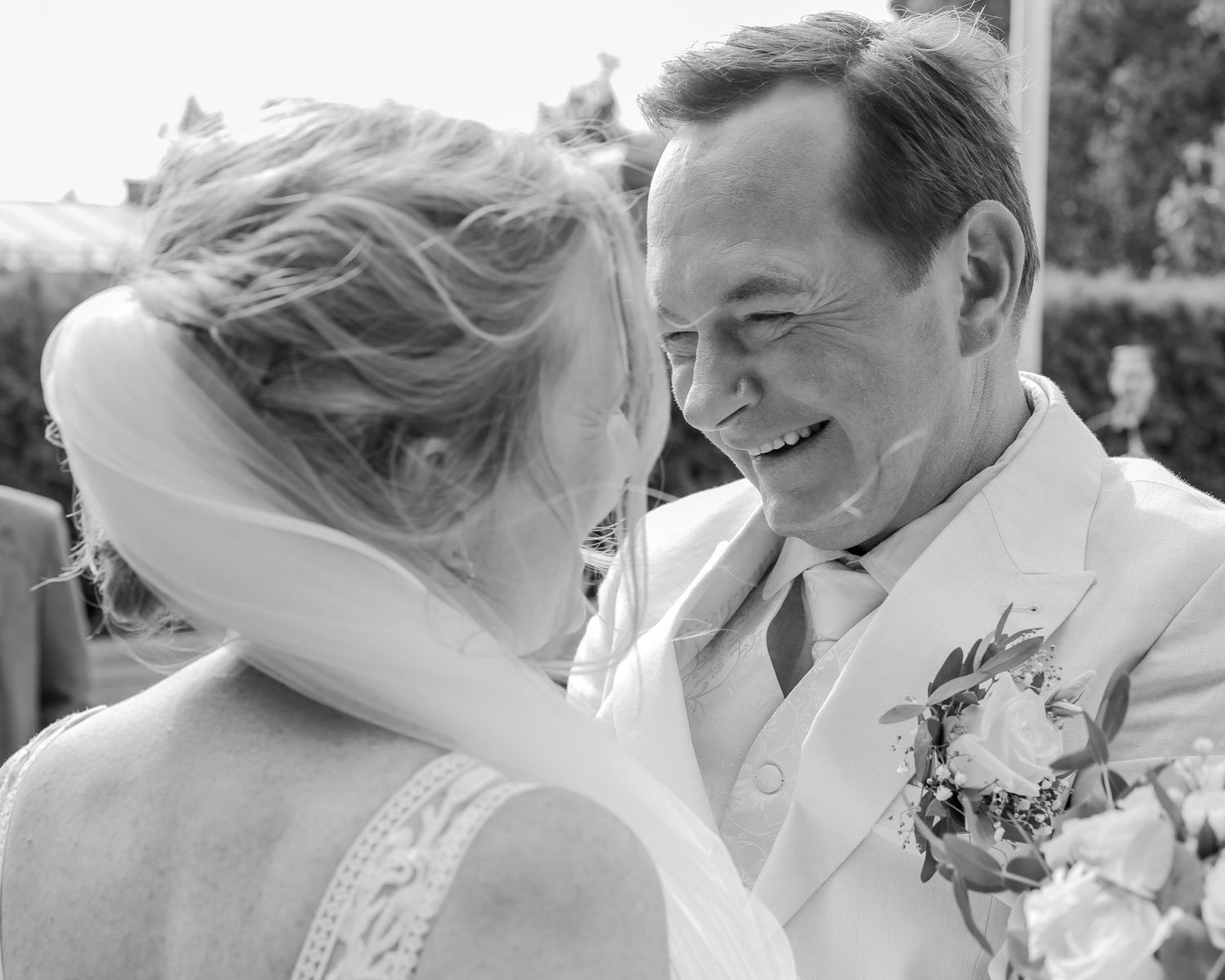 Intimate black and white wedding moment captured in natural light.