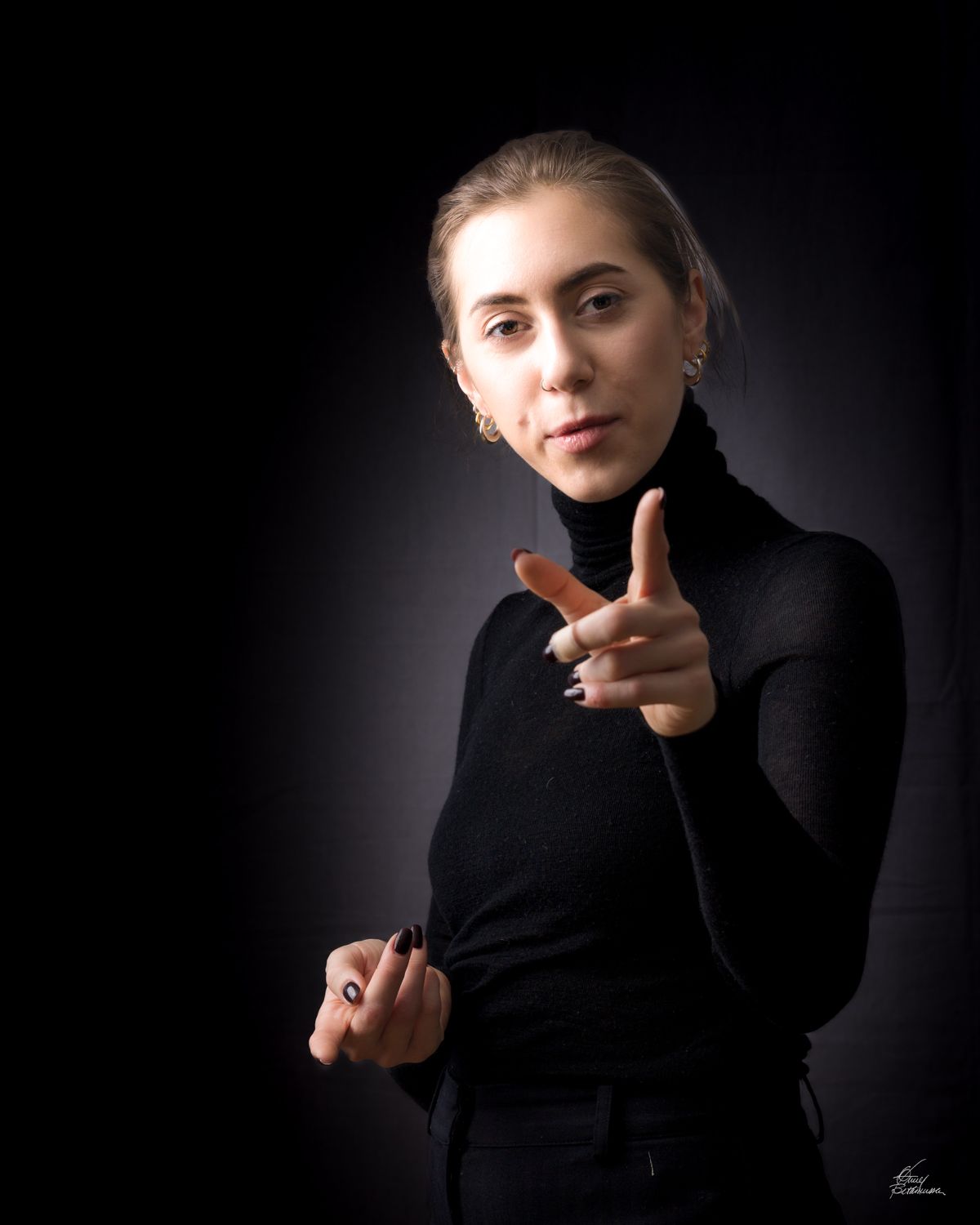 Dramatic black and white portrait series with hand gestures and expressive poses.