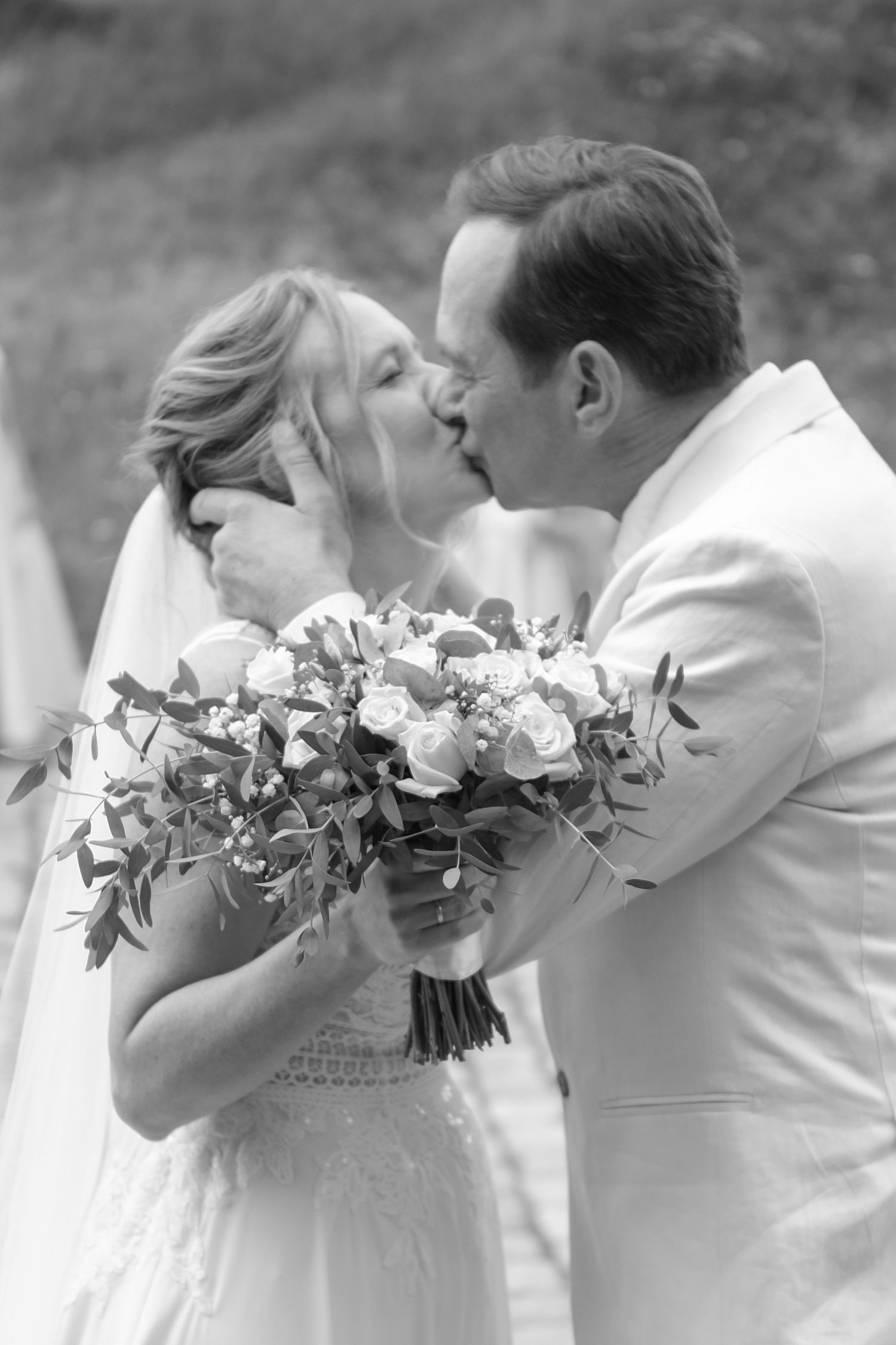 A romantic black and white wedding portrait sequence showing tender moments between newlyweds.