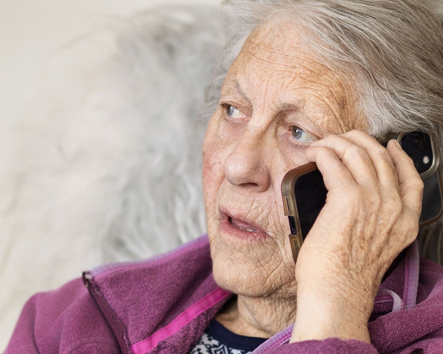 Series of candid moments showing elderly hands and purple clothing.