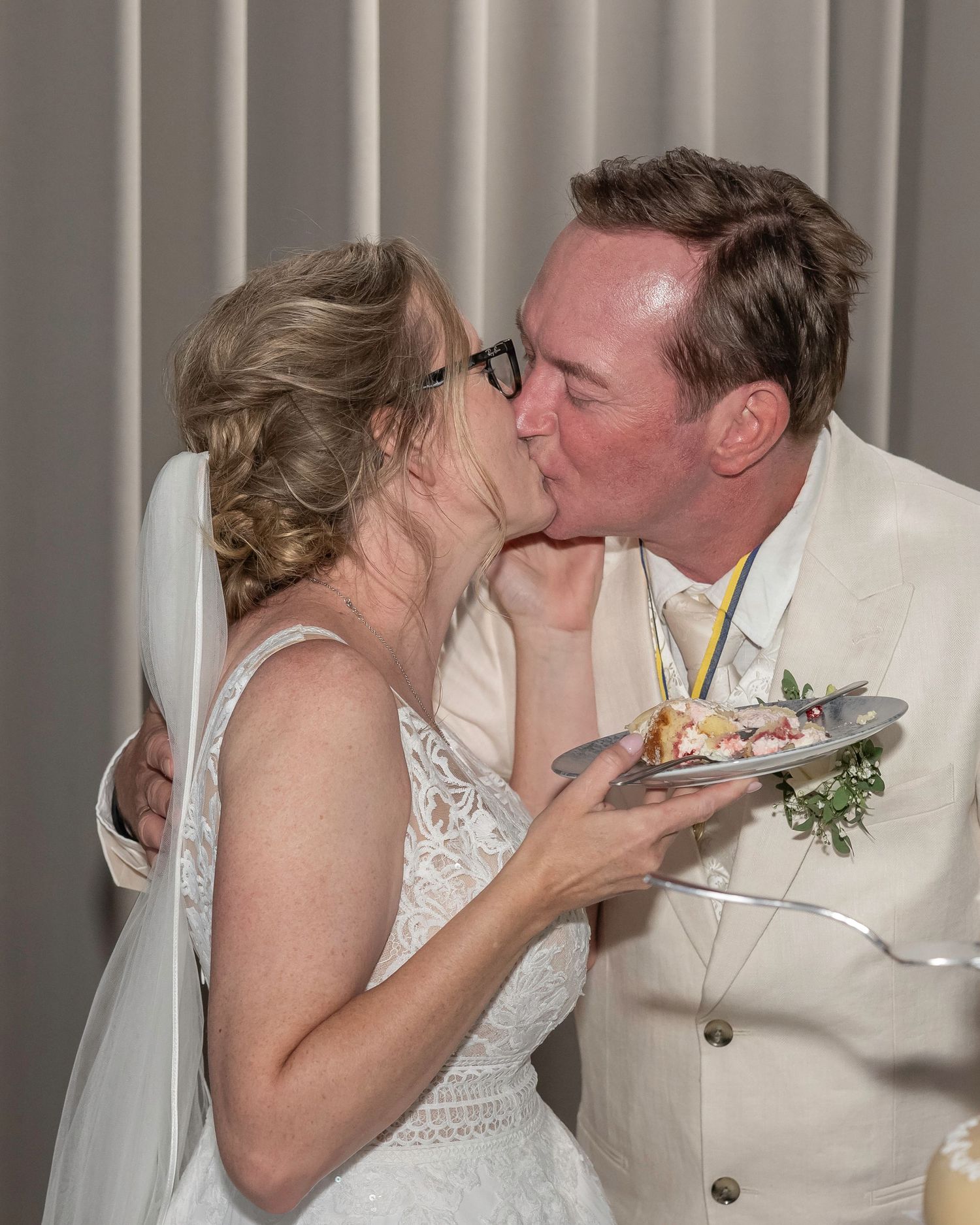 A sequence of romantic moments captured during a wedding celebration in white formal attire.