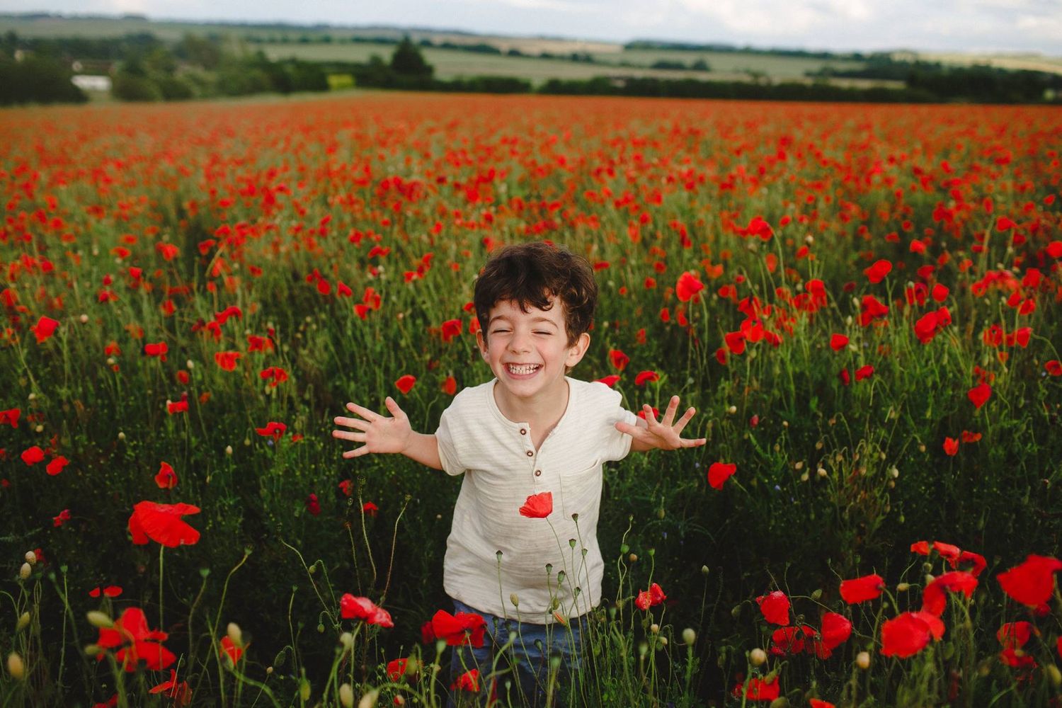 Family photography in poppy field in Hertfordshire by Essex family photographer