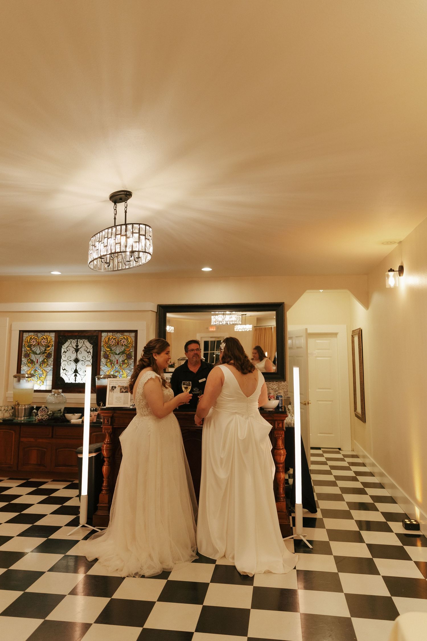A sequence of photos showing a black and white checkered floor room with white decor and chandeliers.