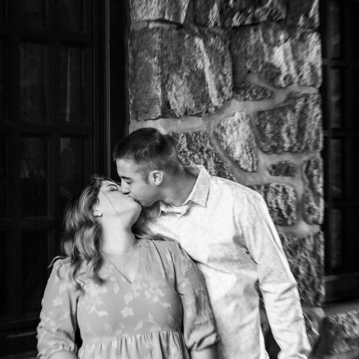 Black and white romantic portrait of couple sharing intimate moment.