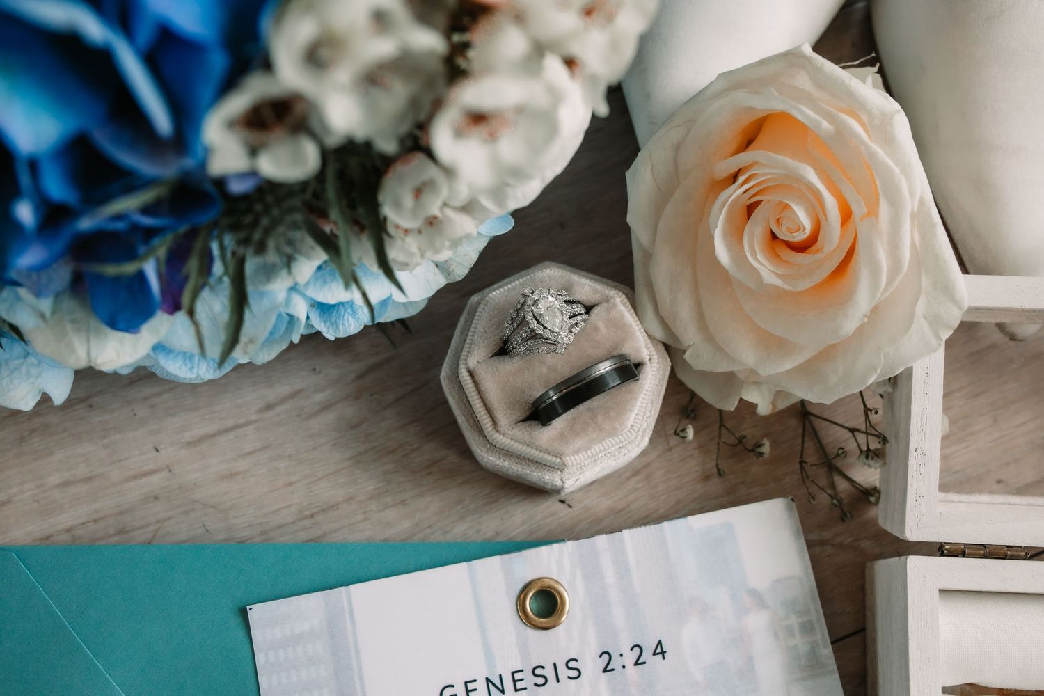 Close-up of elegant wedding invitation details in navy and peach color scheme.