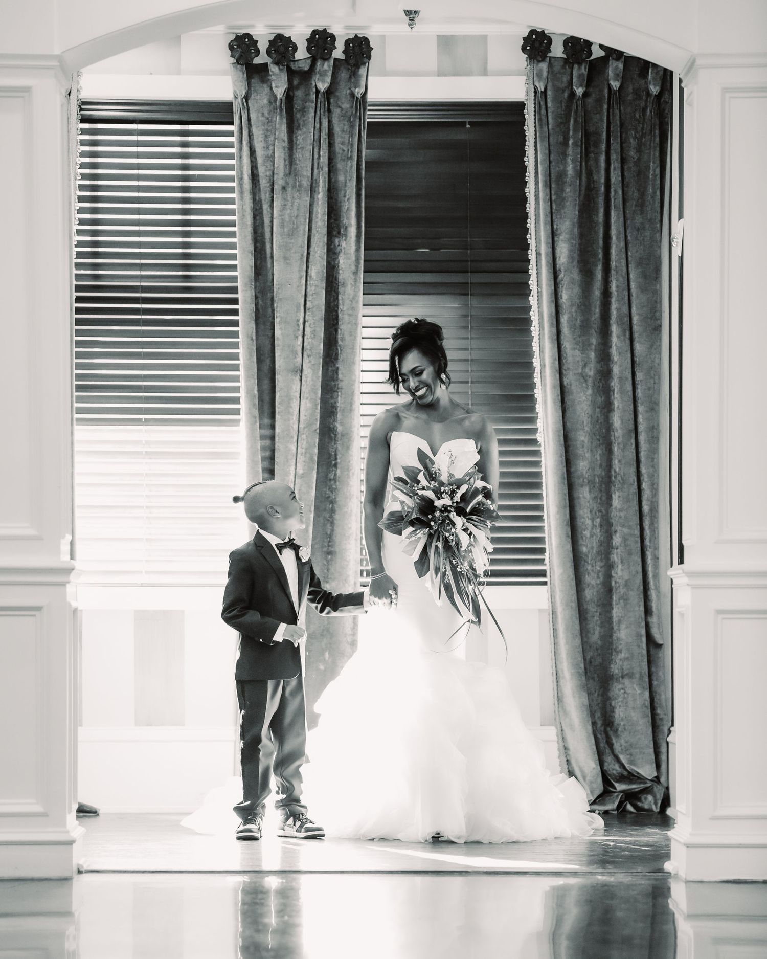 A quiet black and white first look, capturing a tender moment between mother and son just before he walked her down the aisle. A pause in ti