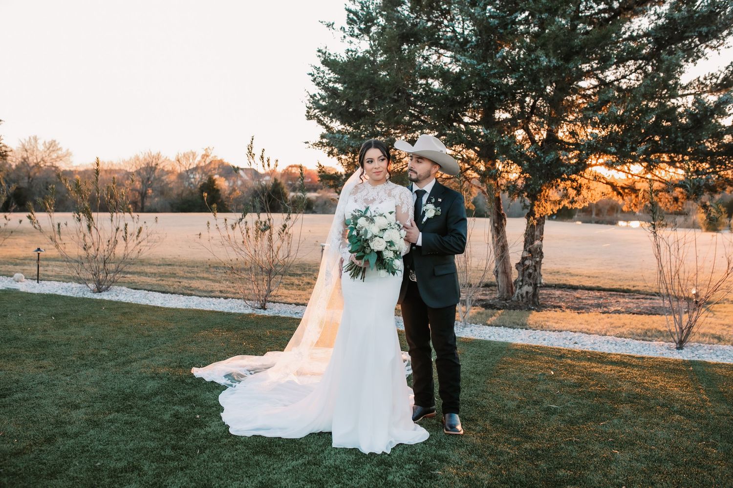 Outdoor wedding photos captured at sunset with scenic natural backdrop.