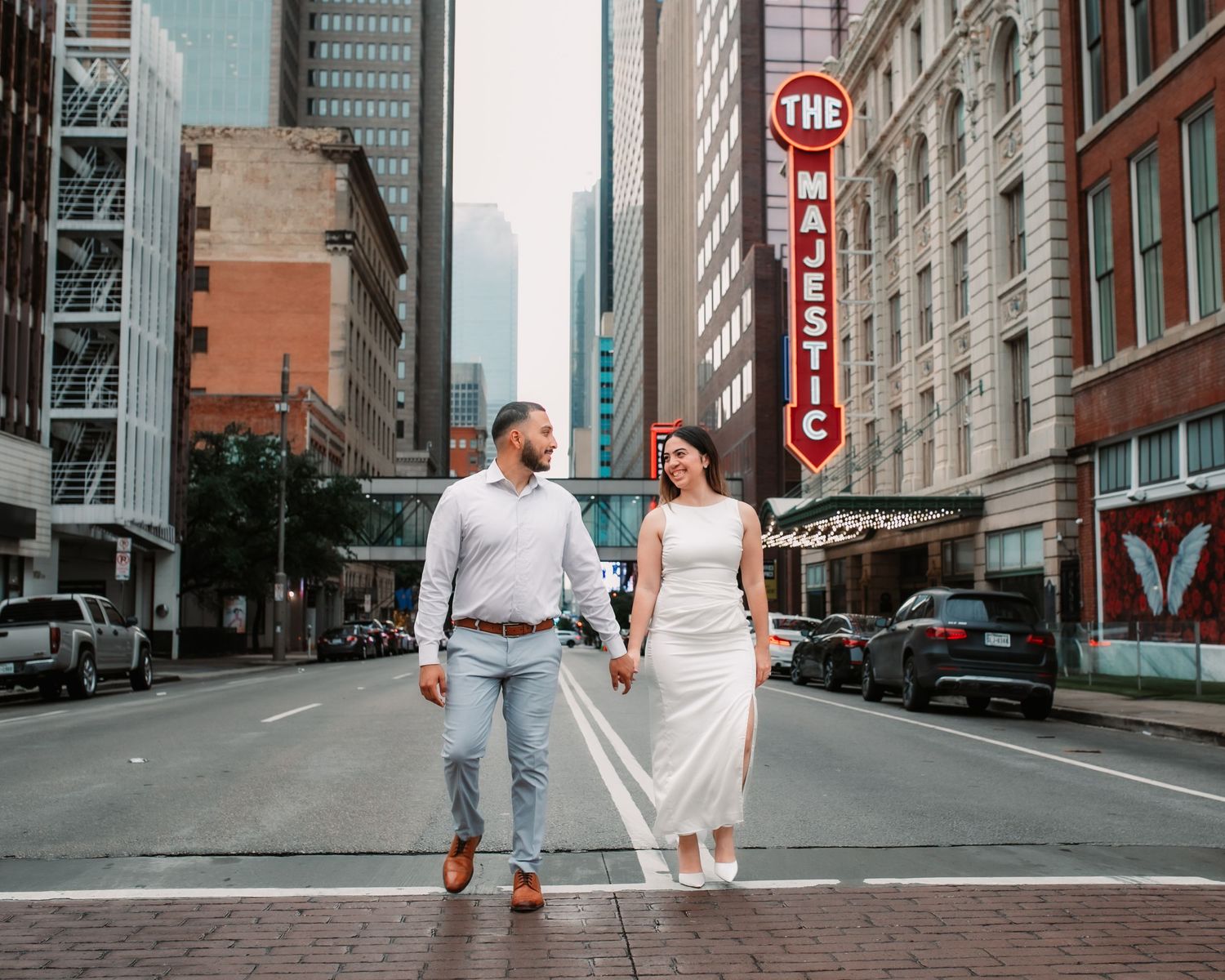 Downtown street scene with vintage architecture and stop signs creating romantic urban backdrop.