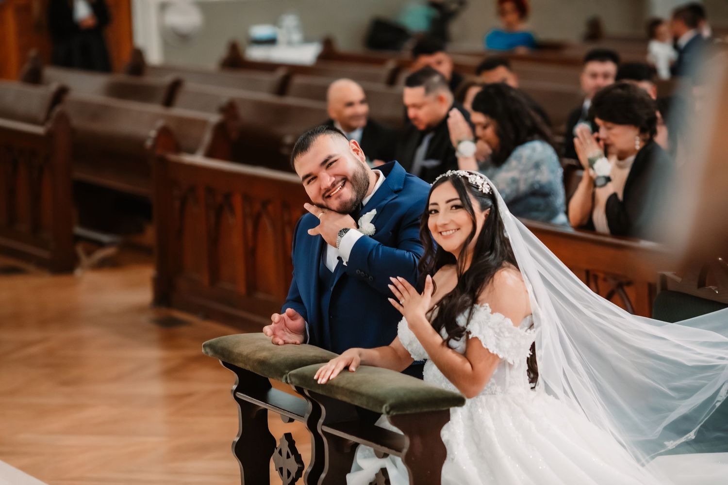 A couple shares a joyful moment during their church wedding ceremony.