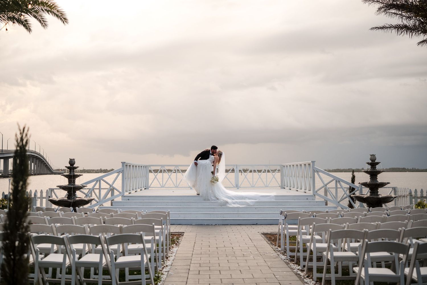 Bride and groom together at their waterfront outdoor wedding ceremony in Florida