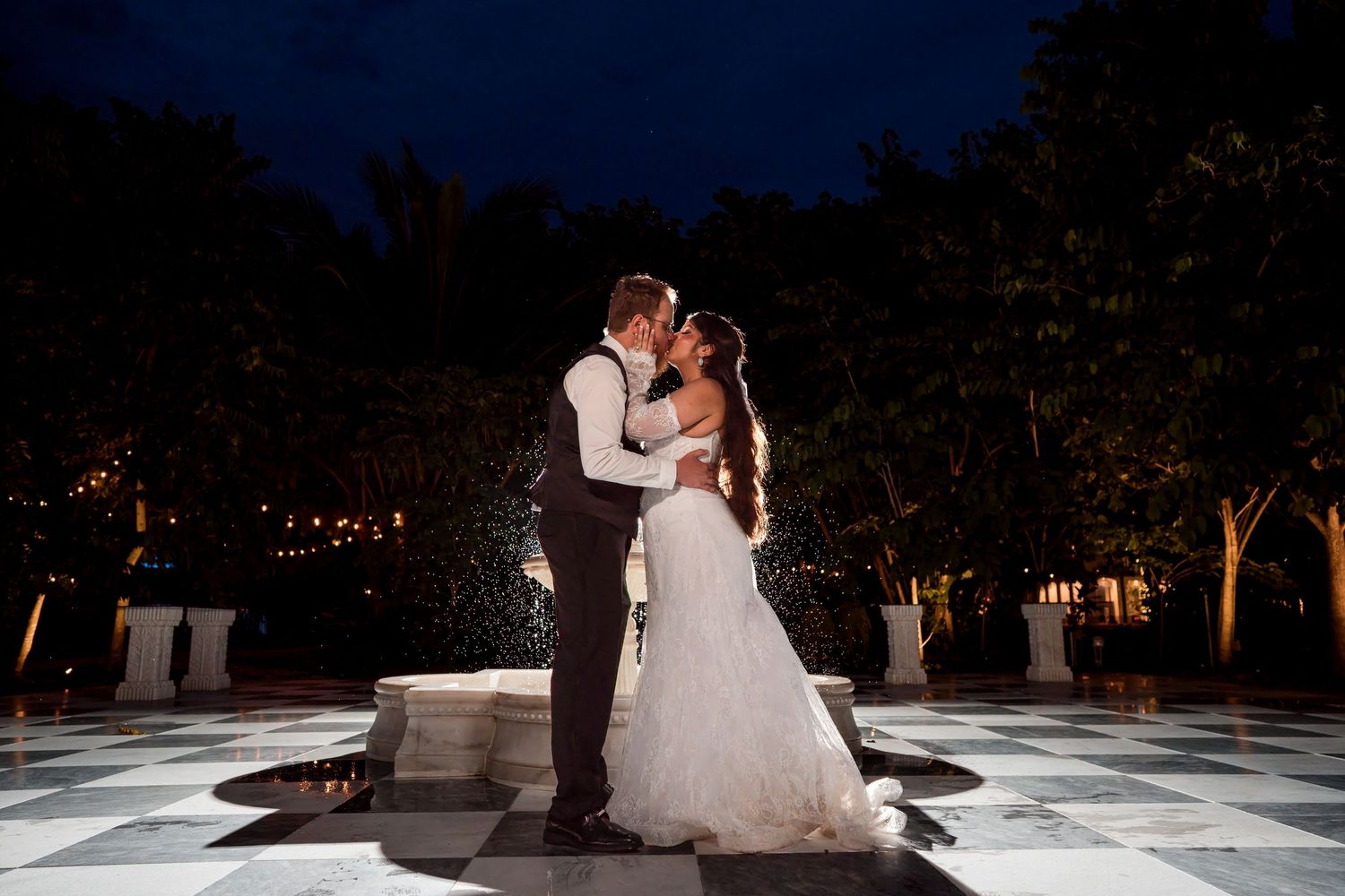 Bride and groom embracing during an evening wedding at Casa Ylang Ylang