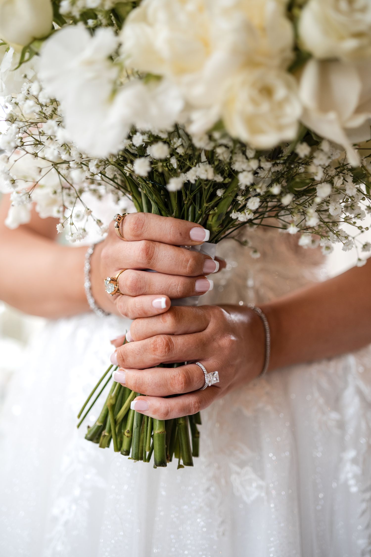 Bride holding a white floral bouquet during wedding preparations in Florida