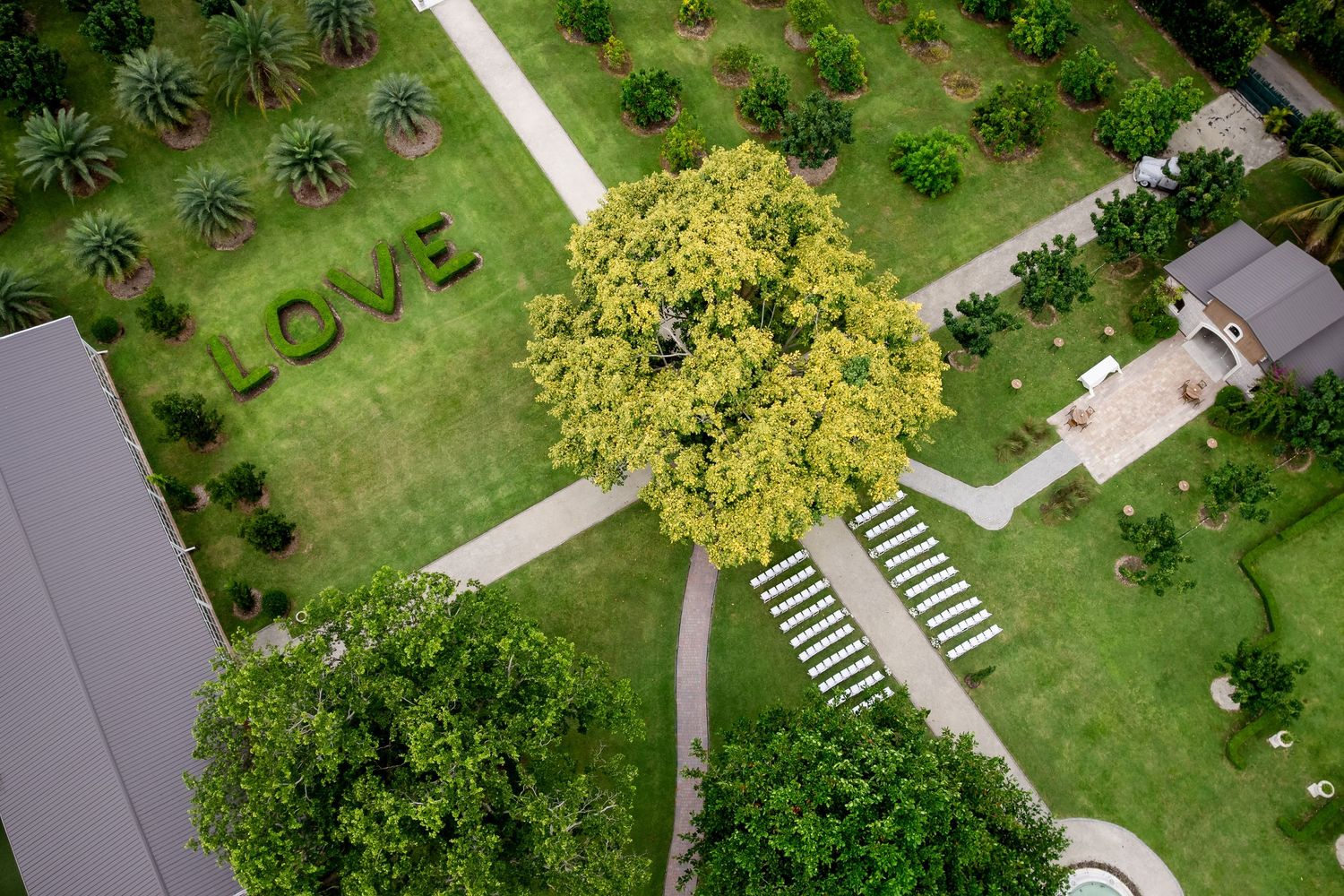 Aerial view of an outdoor garden wedding ceremony setup in Florida