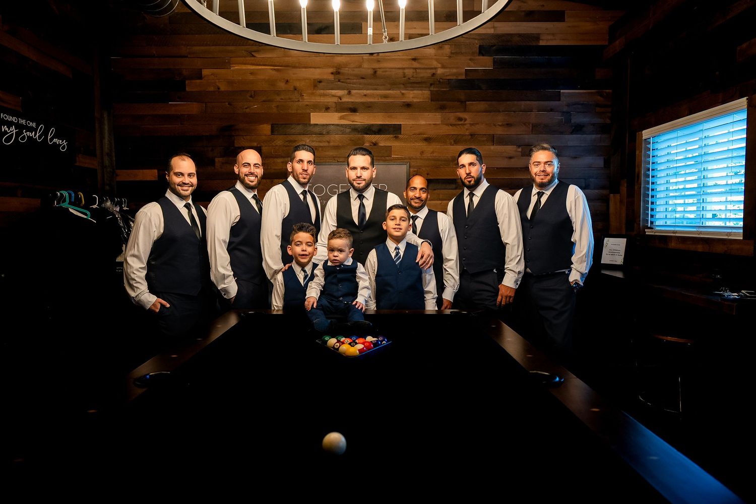 Groom and groomsmen posing together during wedding preparations in Florida