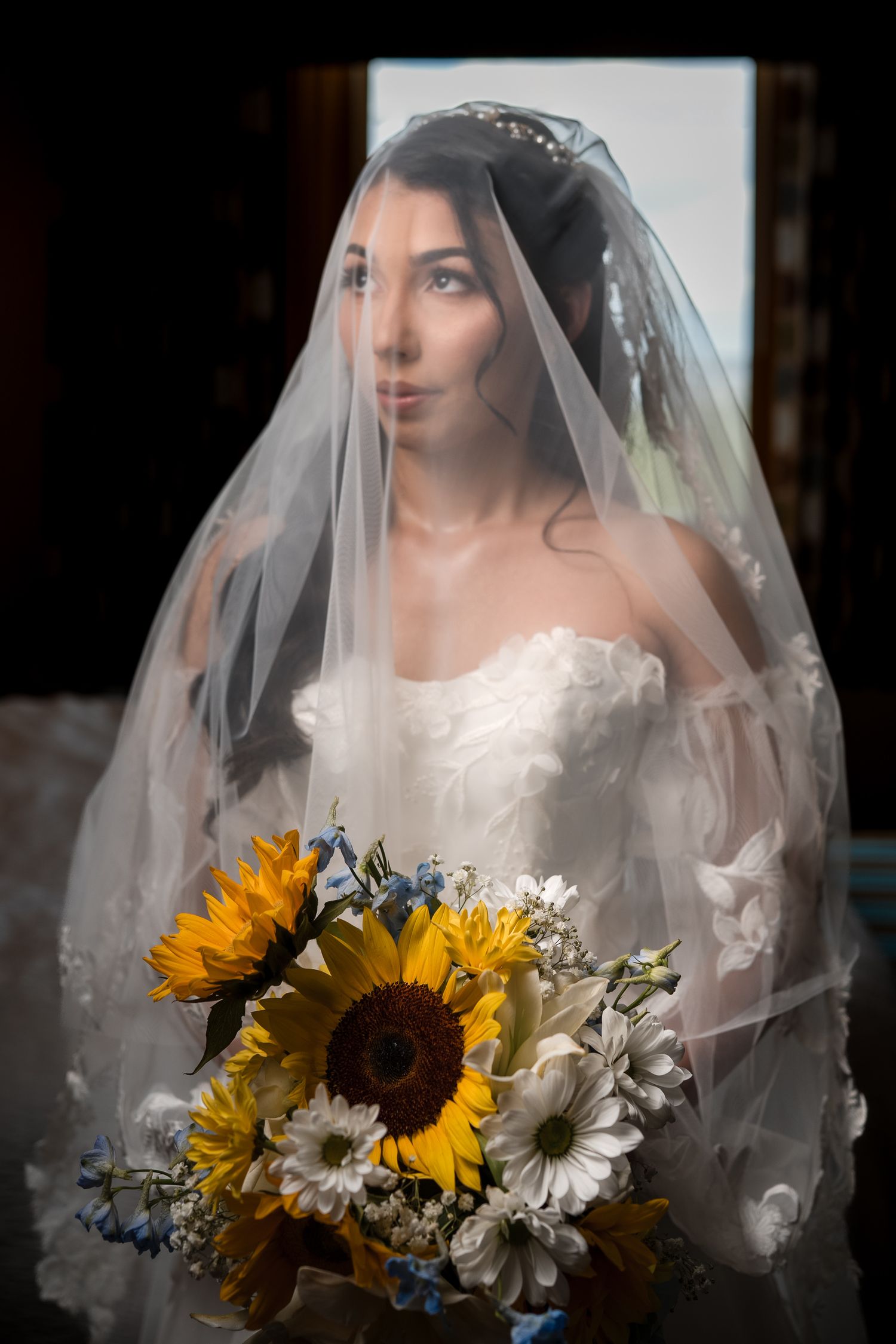 Bride holding a sunflower bouquet during her Miami wedding