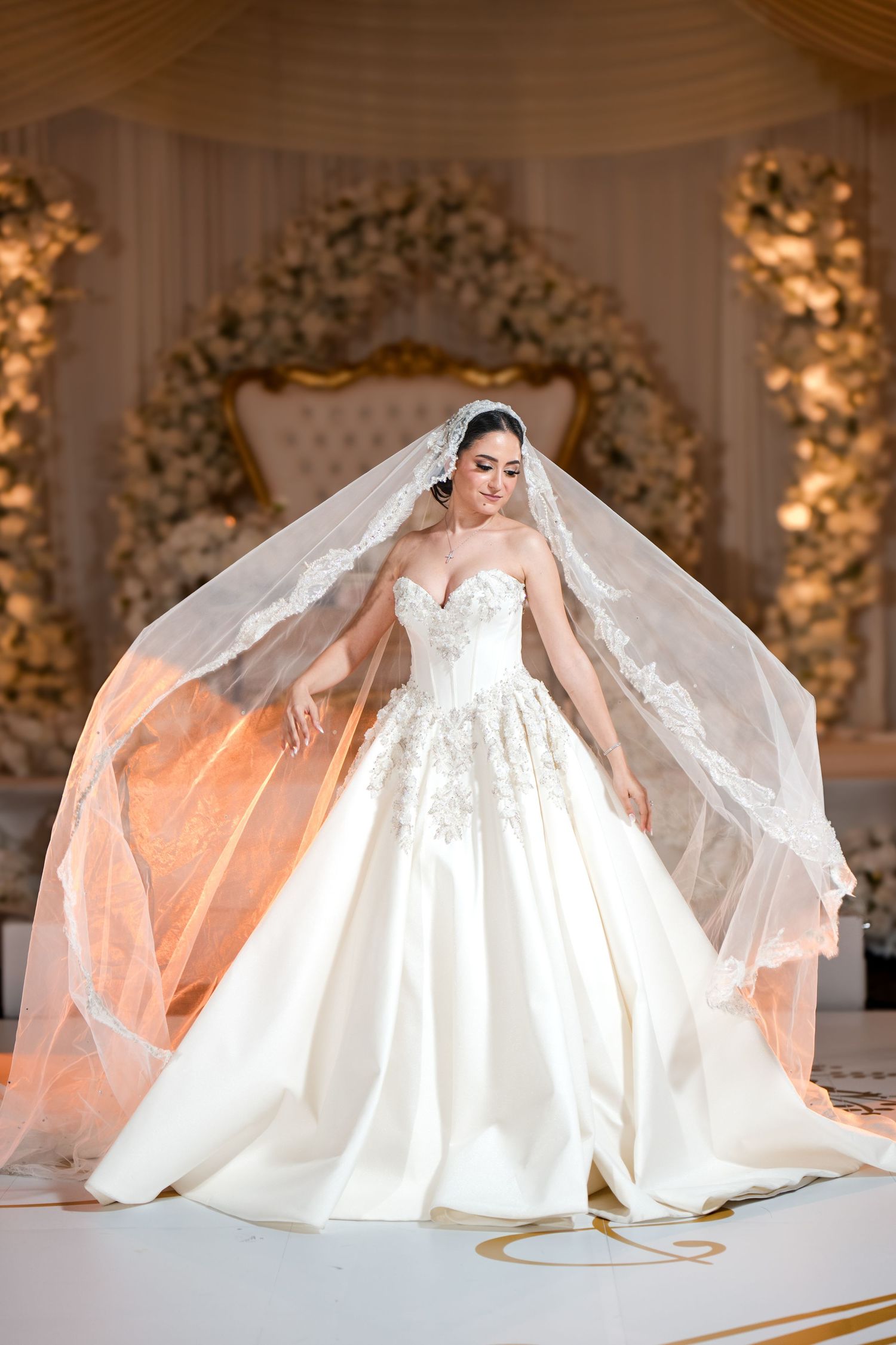 Bride posing in her wedding gown and veil during a Jacksonville wedding