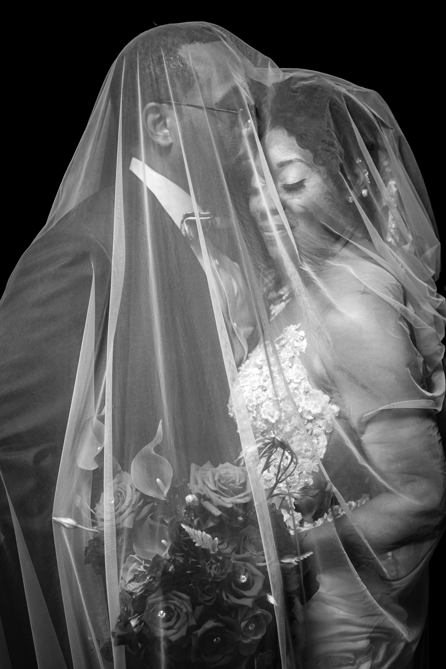 Bride portrait beneath her veil at Secret Gardens Miami