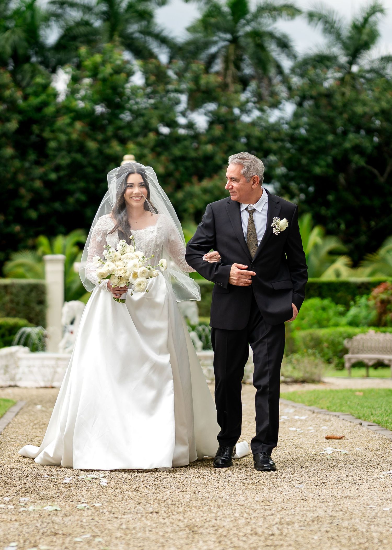 Bride posing outdoors with a family member before the wedding ceremony