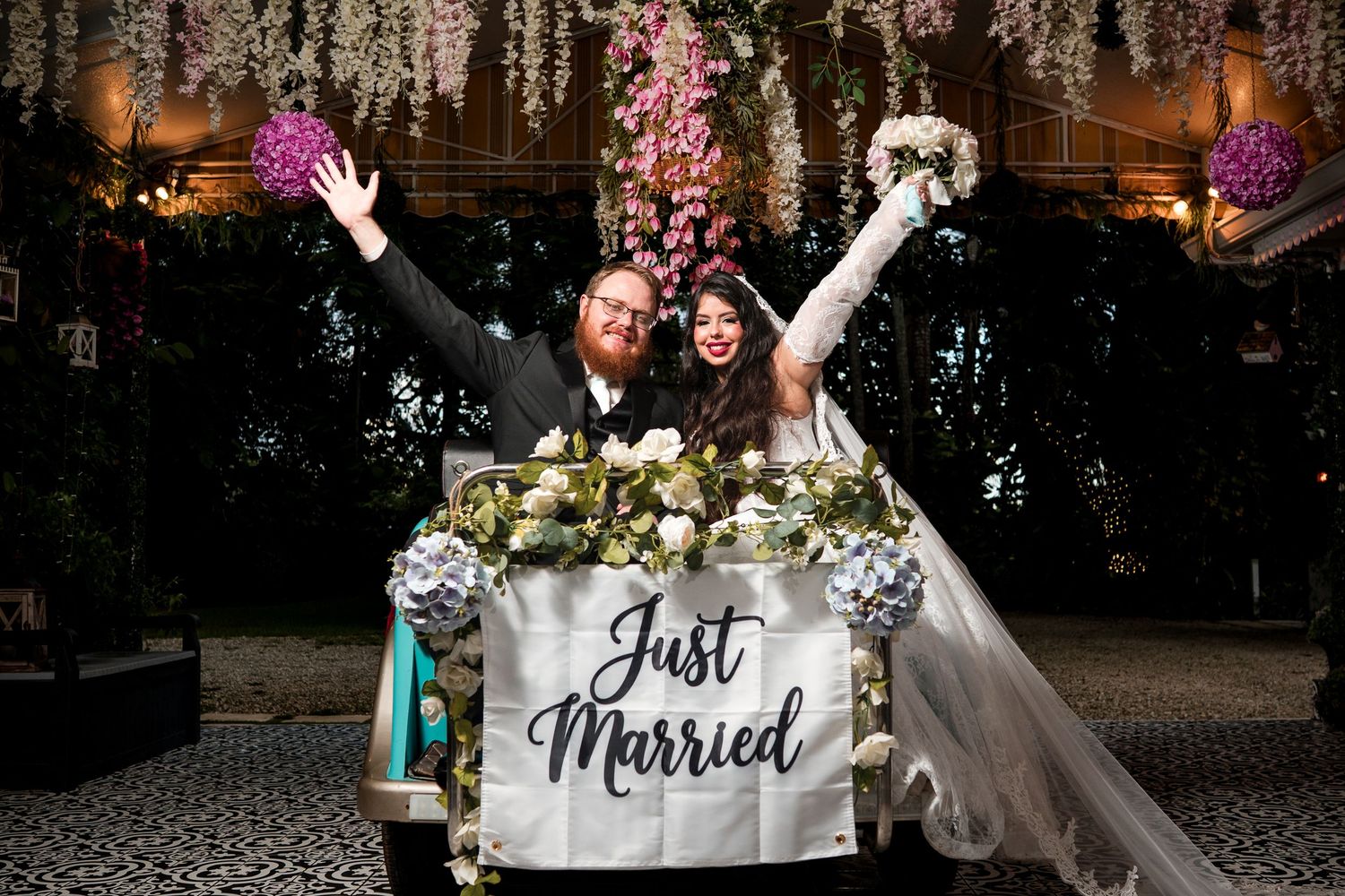 Newlyweds celebrating together at their sweetheart table during a Casa Ylang Ylang wedding