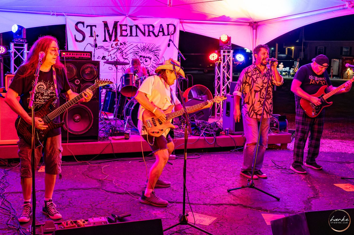 Rock band performing under purple lights at the 2025 St. Meinrad Rocks Fest outdoor festival at night.