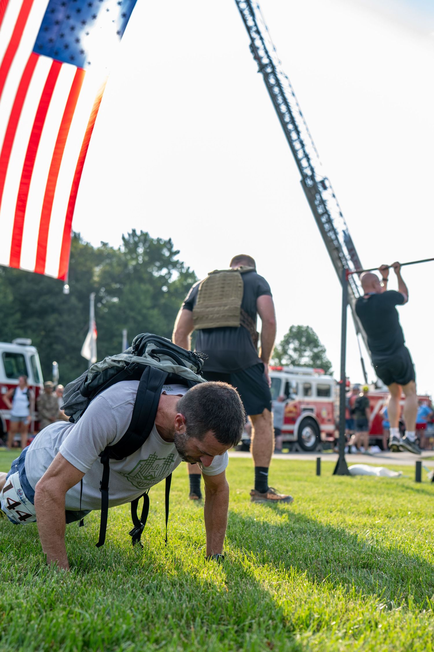 Veterans performing a military honor guard salute ceremony outdoors on a paved path during the 2026 Honor and Remember Run at Cool Springs