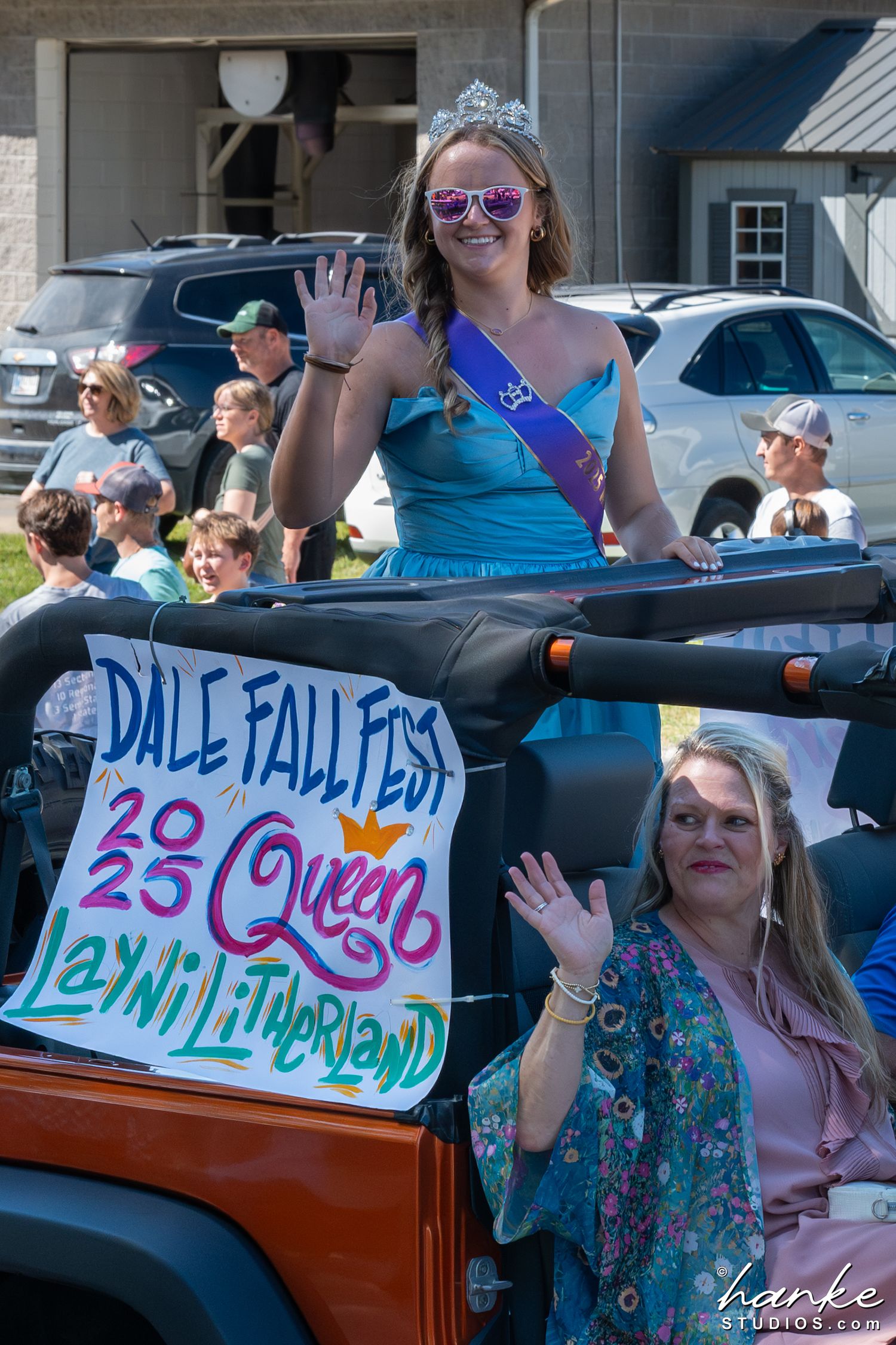 Dale Fall Fest 2023 Queen Layni Litherland waves from a Jeep during a festive parade.