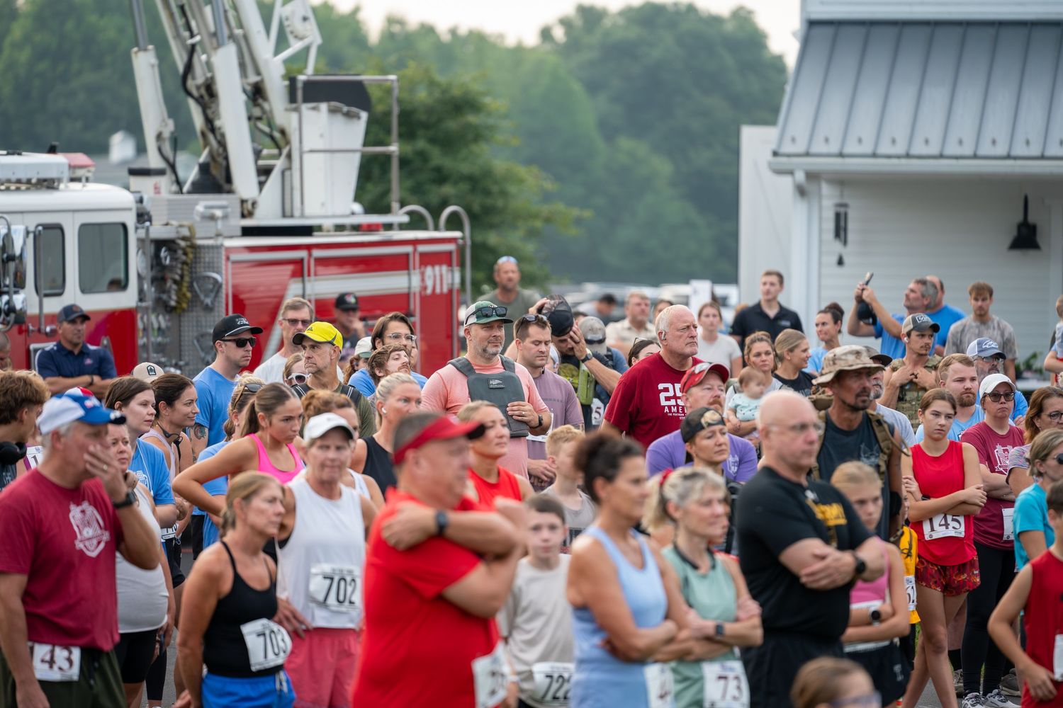 Large crowd of runners gathers at the start of an outdoor road race during the 2026 Honor and Remember Run at Cool Springs, OFS Brands