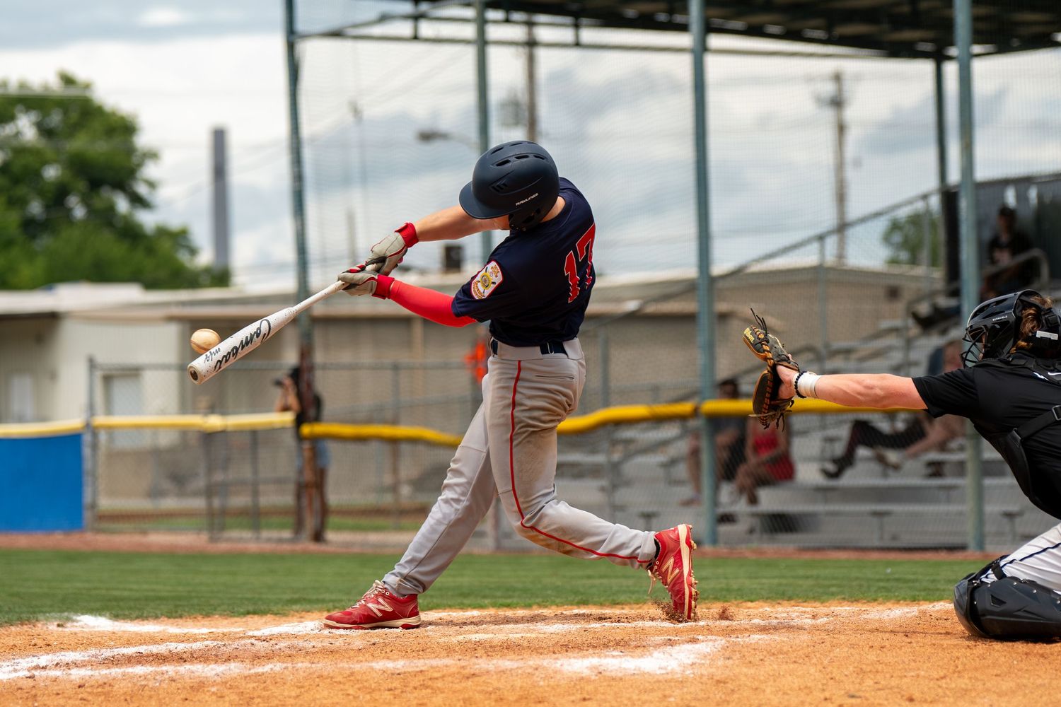 Rockport American Legion Baseball batter makes contact with pitch during a competitive youth league game.