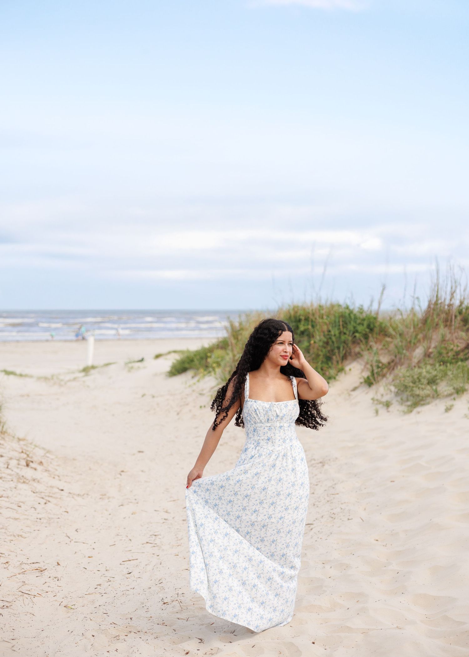 Artistic photo sequence showing a flowing white dress movement against a sandy beach backdrop and coastal dunes.
