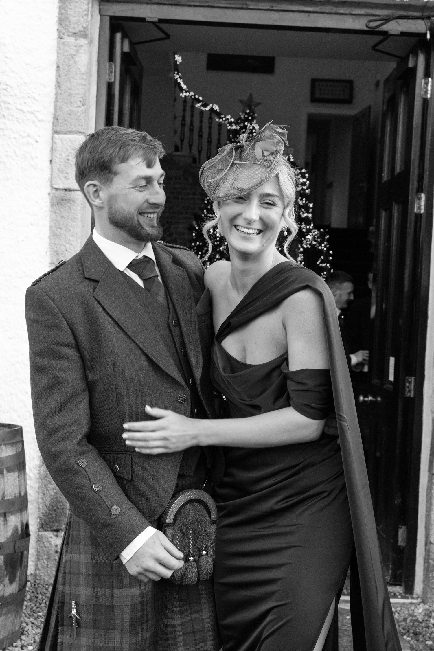 Candid wedding photos showing joyful moments between couple outside stone venue.