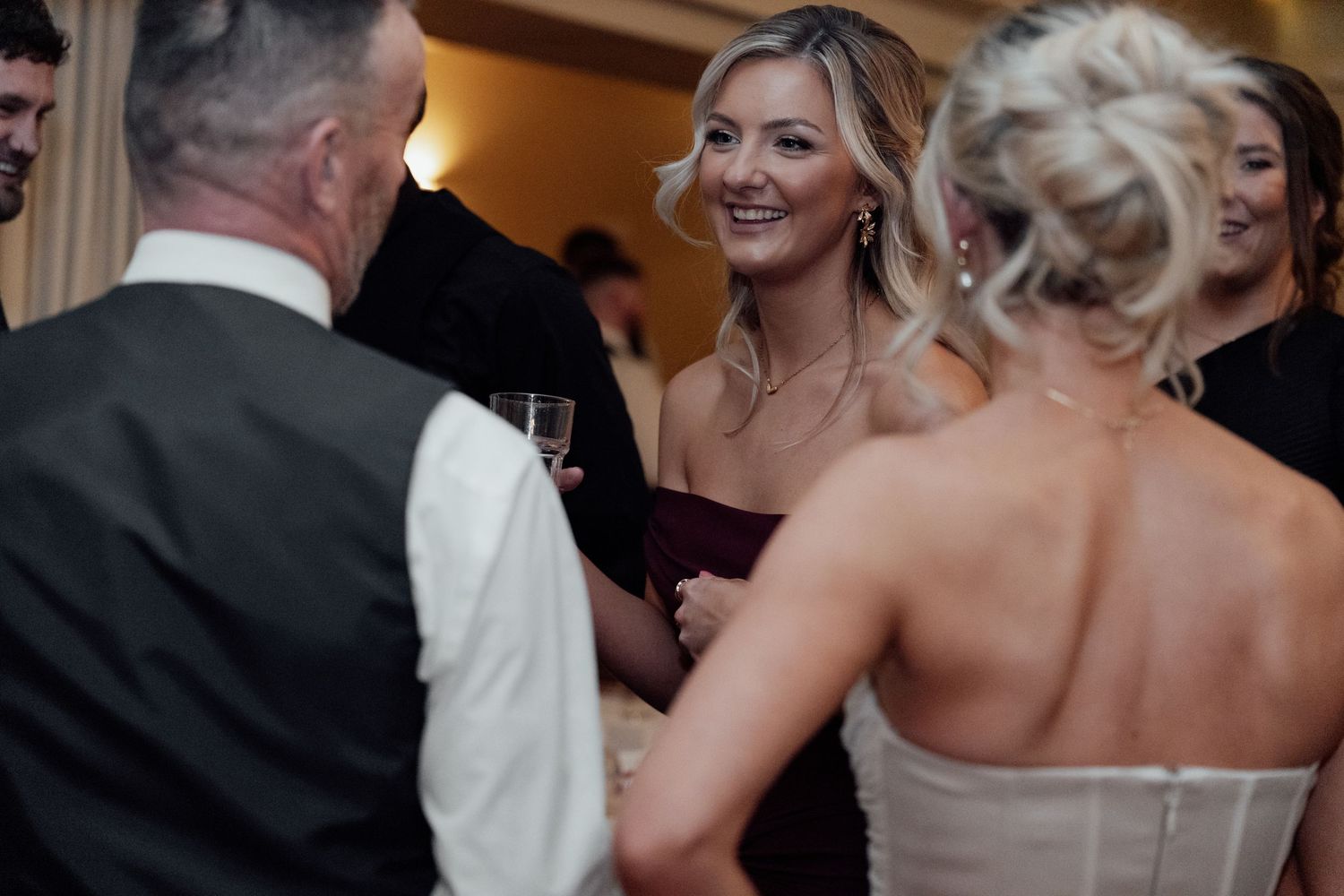 Guests mingle and socialize during an elegant evening wedding reception.